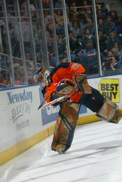 UNIONDALE, NY - OCTOBER 29:  Goalie Rick DiPietro #39 of the New York Islanders passes the puck during the game against the Buffalo Sabres at the Nassau Coliseum on October 29, 2005 in Uniondale, New York. The Sabres won 6-4. (Photo by Bruce Bennett/Getty