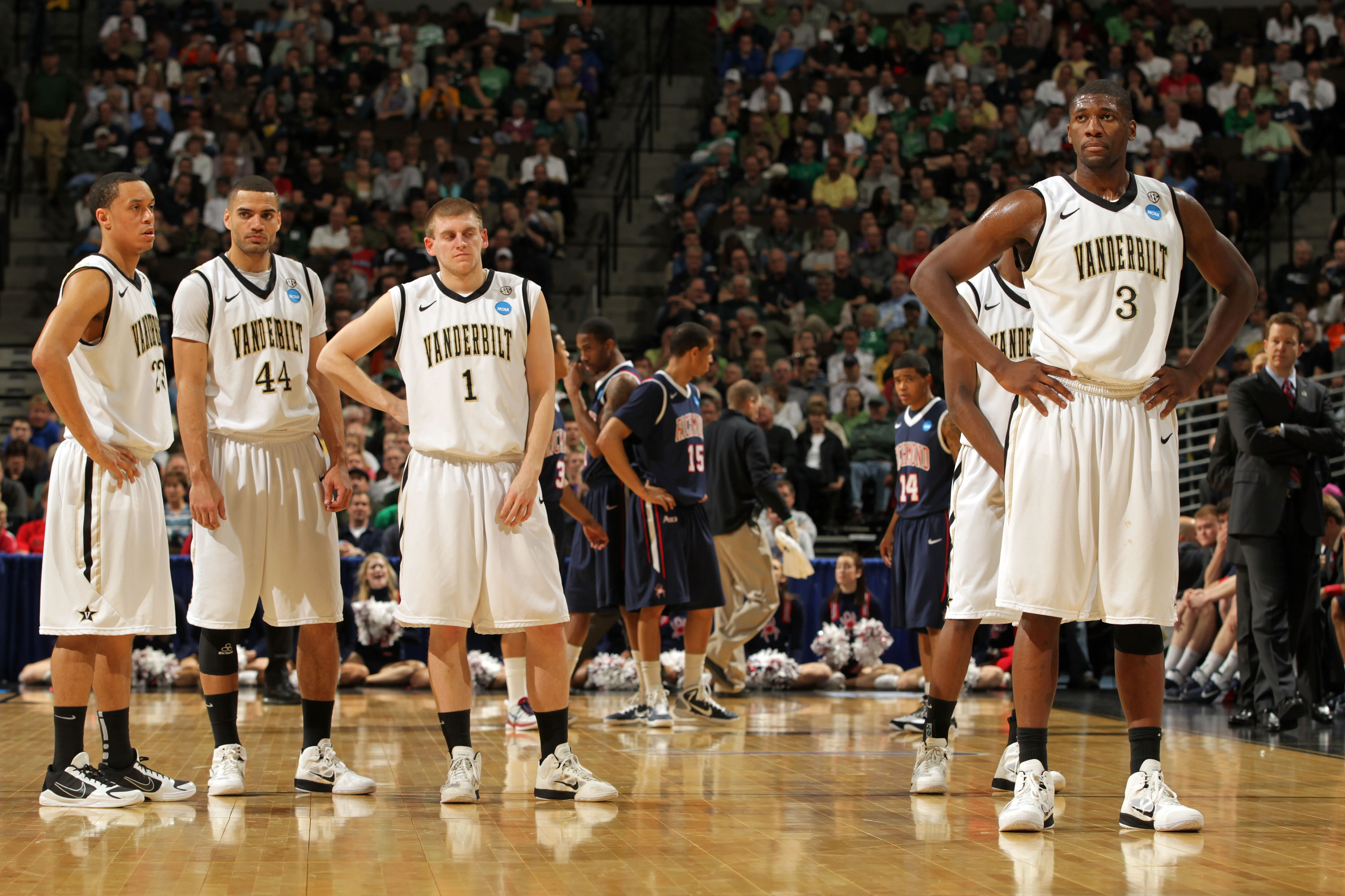 DENVER, CO - MARCH 17:  John Jenkins #23, Jeffery Taylor #44 Brad Tinsley #1 and Festus Ezeli #3 of the Vanderbilt Commodores look on during a break in play against the Richmond Spiders during the second round of the 2011 NCAA men's basketball tournament