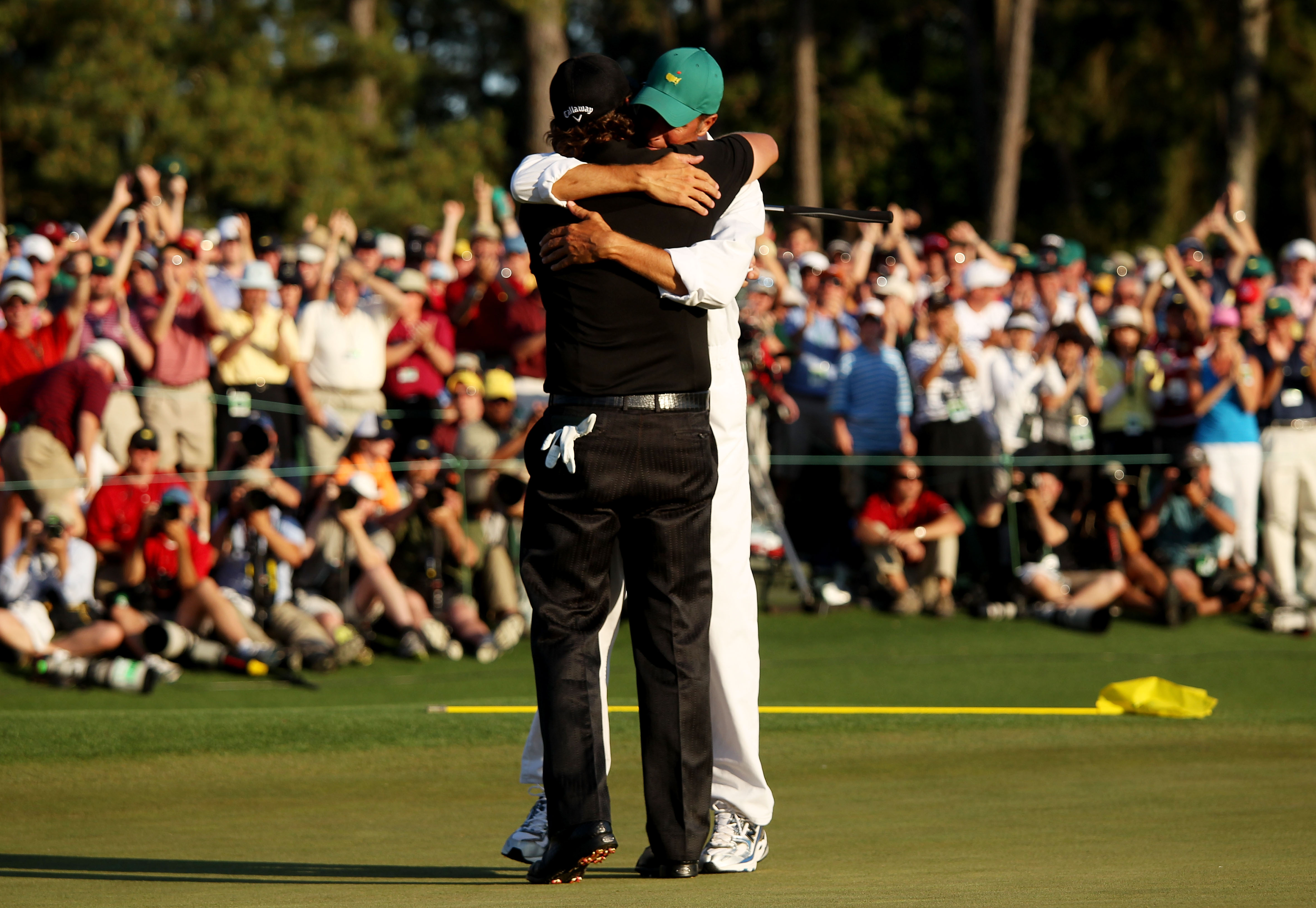 AUGUSTA, GA - APRIL 11:  Phil Mickelson celebrates with his caddie Jim Mackay after his three-stroke victory after winning the 2010 Masters Tournament at Augusta National Golf Club on April 11, 2010 in Augusta, Georgia.  (Photo by Andrew Redington/Getty I