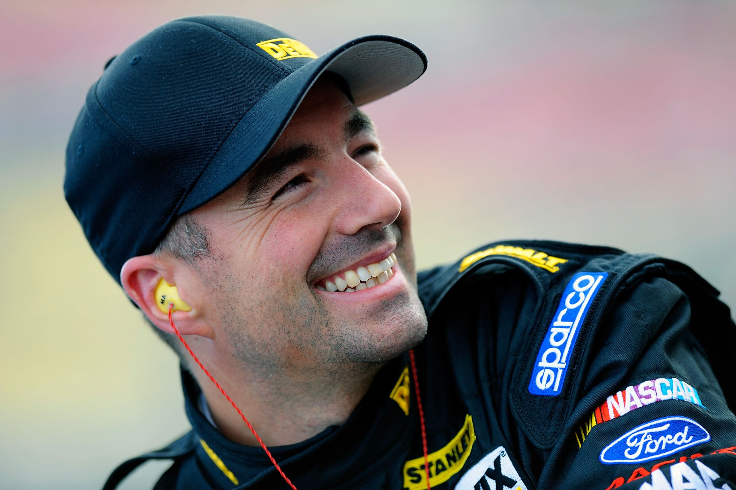 FONTANA, CA - MARCH 25:  Marcos Ambrose, driver of the #9 DeWalt Ford, waits on pit road during qualifying for the NASCAR Sprint Cup Series Auto Club 400 at Auto Club Speedway on March 25, 2011 in Fontana, California.  (Photo by Jared C. Tilton/Getty Imag