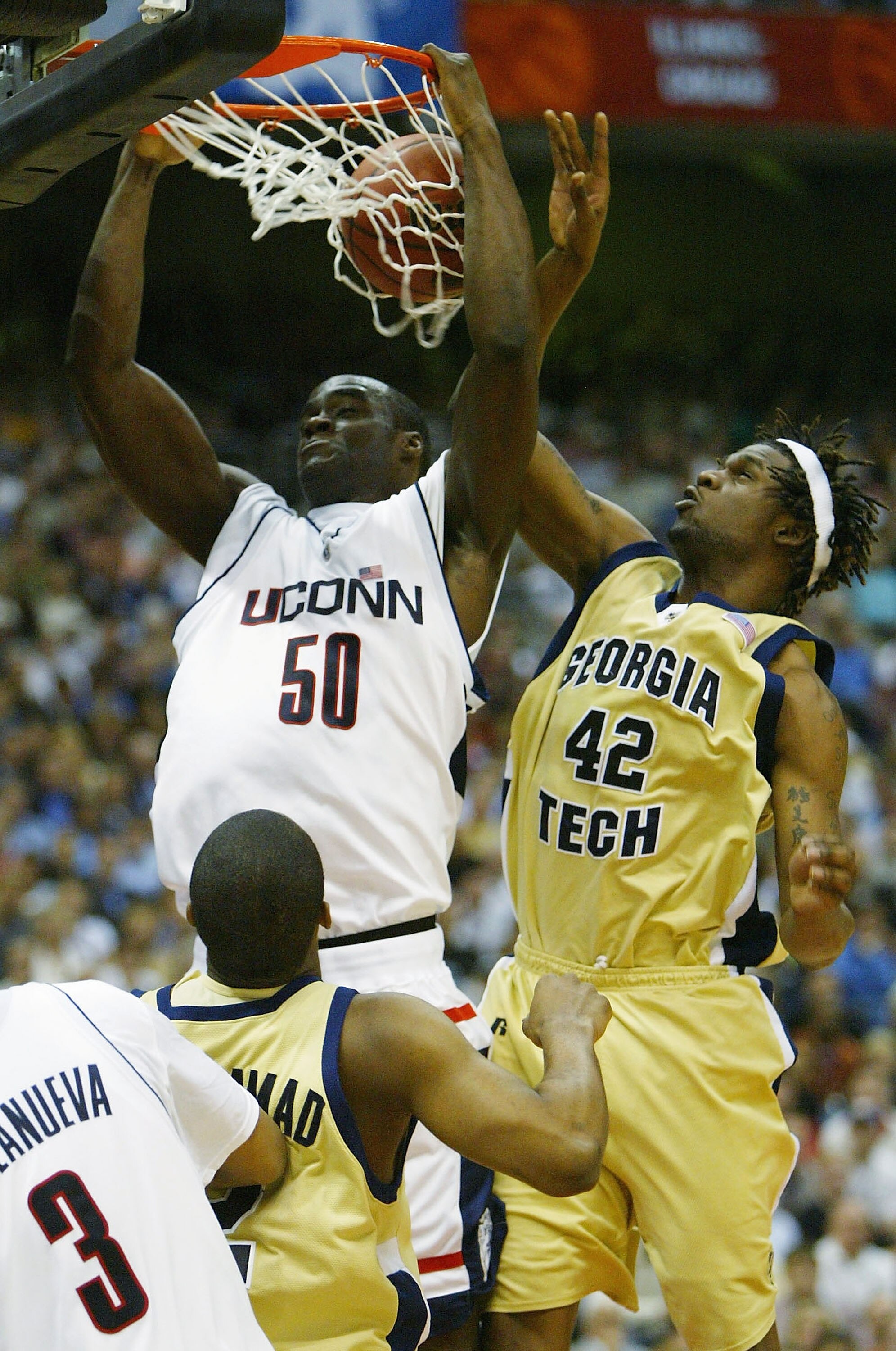 SAN ANTONIO - APRIL 5:  Emeka Okafor #50 of the UConn Huskies dunks the ball around the defense of Clarence Moore #42 of the Georgia Tech Yellow Jackets during the National Championship game of the NCAA Men's Final Four Tournament at the Alamodome on Apri