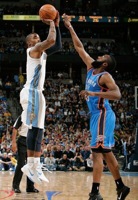 DENVER, CO - APRIL 23:  J.R. Smith #5 of the Denver Nuggets pulls up from three-point range against James Harden #13 of the Oklahoma City Thunder in Game Three of the Western Conference Quarterfinals in the 2011 NBA Playoffs at Pepsi Center on April 23, 2