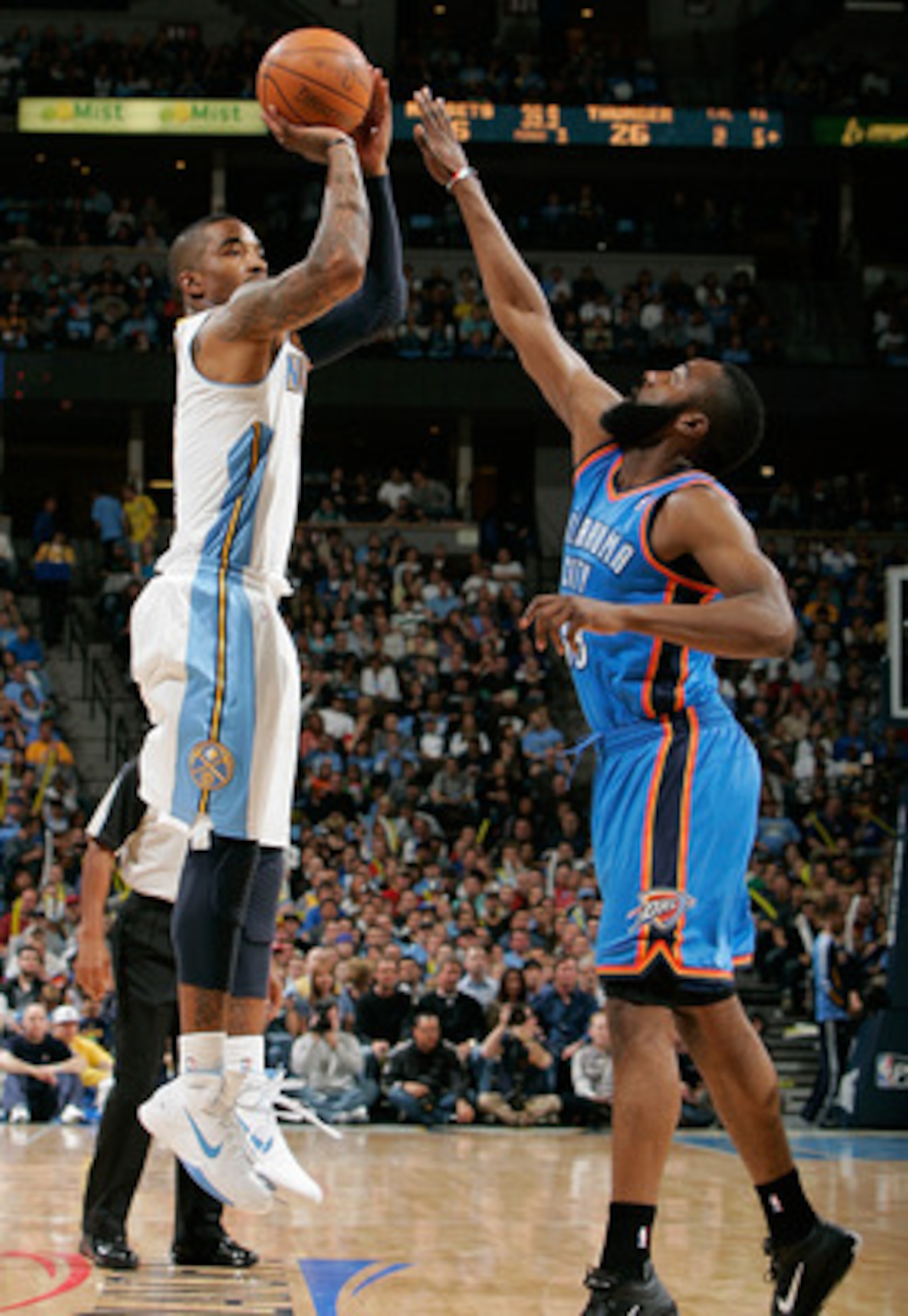 DENVER, CO - APRIL 23:  J.R. Smith #5 of the Denver Nuggets pulls up from three-point range against James Harden #13 of the Oklahoma City Thunder in Game Three of the Western Conference Quarterfinals in the 2011 NBA Playoffs at Pepsi Center on April 23, 2