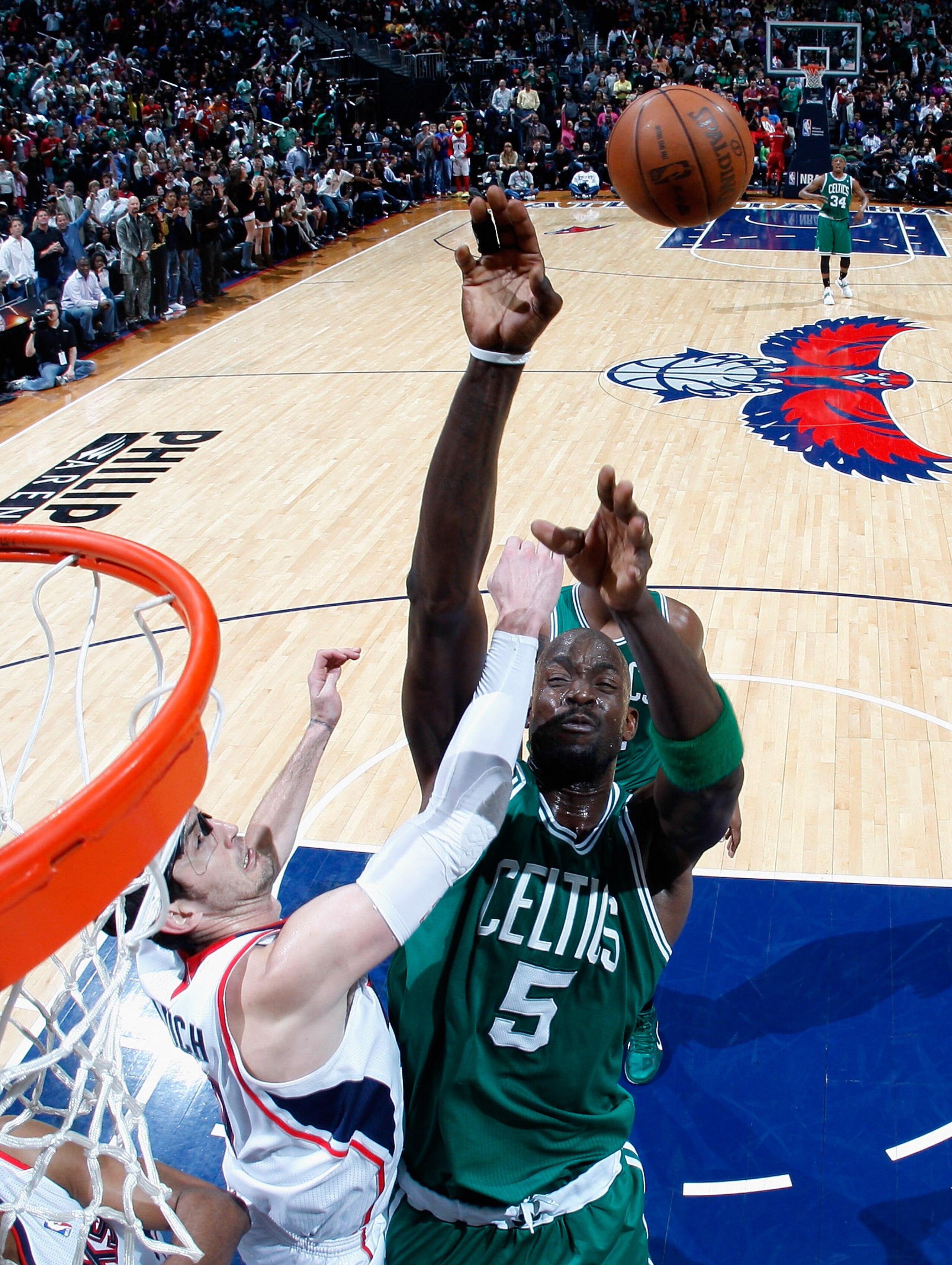 ATLANTA, GA - APRIL 01: Kevin Garnett #5 of the Boston Celtics shoots against Kirk Hinrich #6 of the Atlanta Hawks at Philips Arena on April 1, 2011 in Atlanta, Georgia. NOTE TO USER: User expressly acknowledges and agrees that, by downloading and/or us ATLANTA, GA - APRIL 01: Kevin Garnett #5 of the Boston Celtics shoots against Kirk Hinrich #6 of the Atlanta Hawks at Philips Arena on April 1, 2011 in Atlanta, Georgia. NOTE TO USER: User expressly acknowledges and agrees that, by downloading and/or us