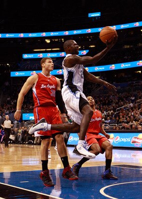 ORLANDO, FL - FEBRUARY 08:  Jason Richardson #23 of the Orlando Magic drives past Blake Griffin #32 of the Los Angeles Clippers during the game at Amway Arena on February 8, 2011 in Orlando, Florida.  NOTE TO USER: User expressly acknowledges and agrees t