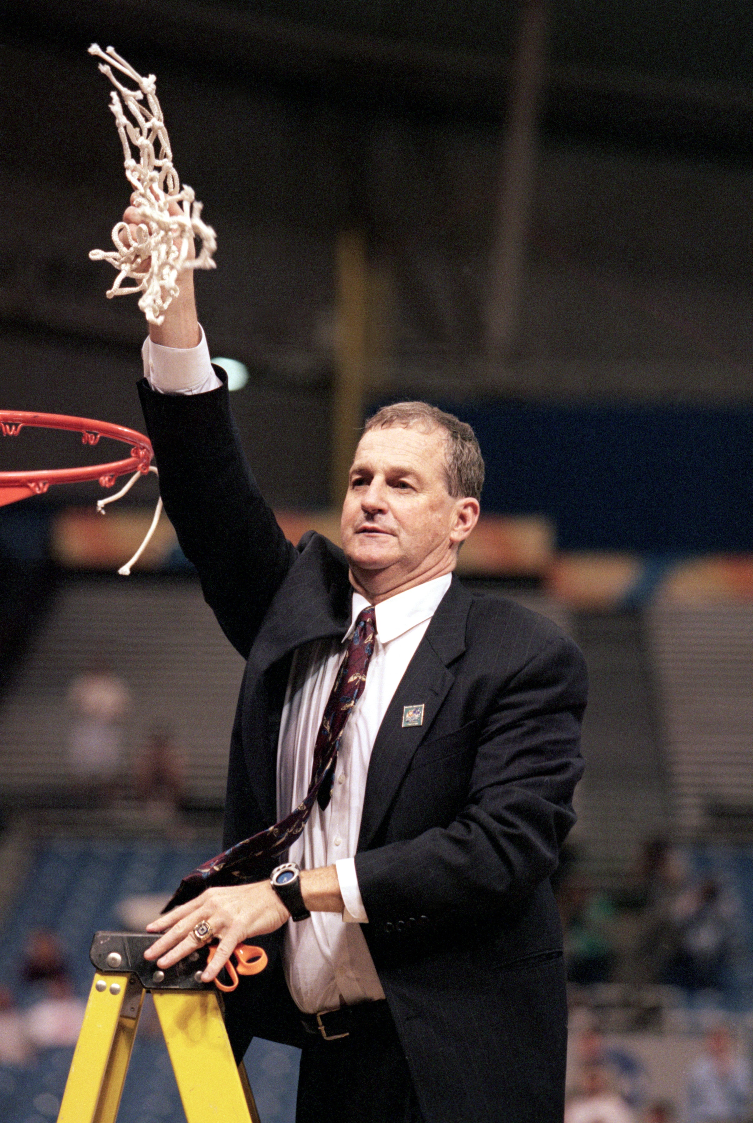 ST. PETERSBURG, FL - MARCH 23:  Head coach Jim Calhoun of the UConn Huskies takes down the net after defeating the Duke University Blue Devils in the NCAA Championship game at the Tropicana Field on March 23, 1999 in St. Petersburg, Florida.  The Huskies