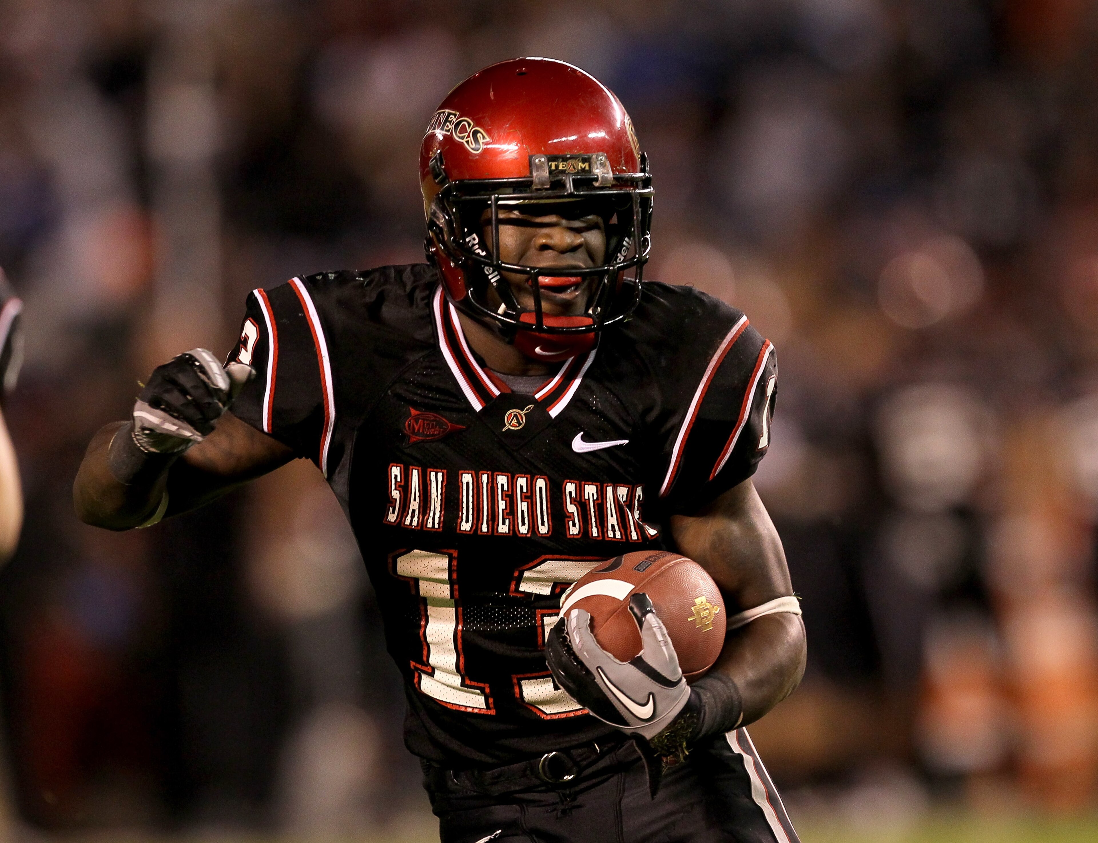 SAN DIEGO - NOVEMBER 20:  Running back Ronnie Hillman #13 of the San Deigo State Aztecs carries the ball on a five yard touchdown run in the second quarter against the Utah Utes at Qualcomm Stadium on November 20, 2010 in San Diego, California.  (Photo by