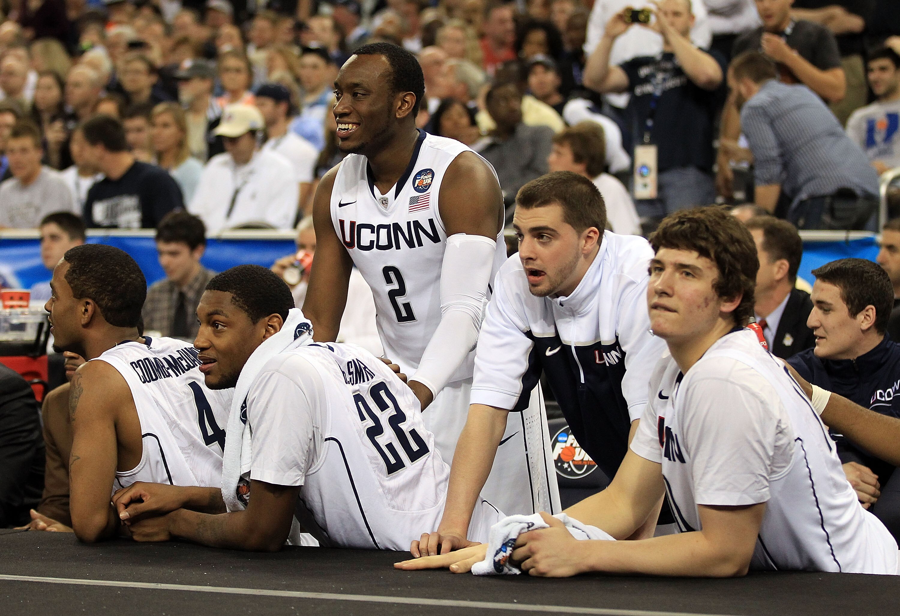HOUSTON, TX - APRIL 04:  Donnell Beverly #2, Jamal Coombs-McDaniel #4, Roscoe Smith #22 and the Connecticut Huskies bench celebrate against the Butler Bulldogs during the National Championship Game of the 2011 NCAA Division I Men's Basketball Tournament a