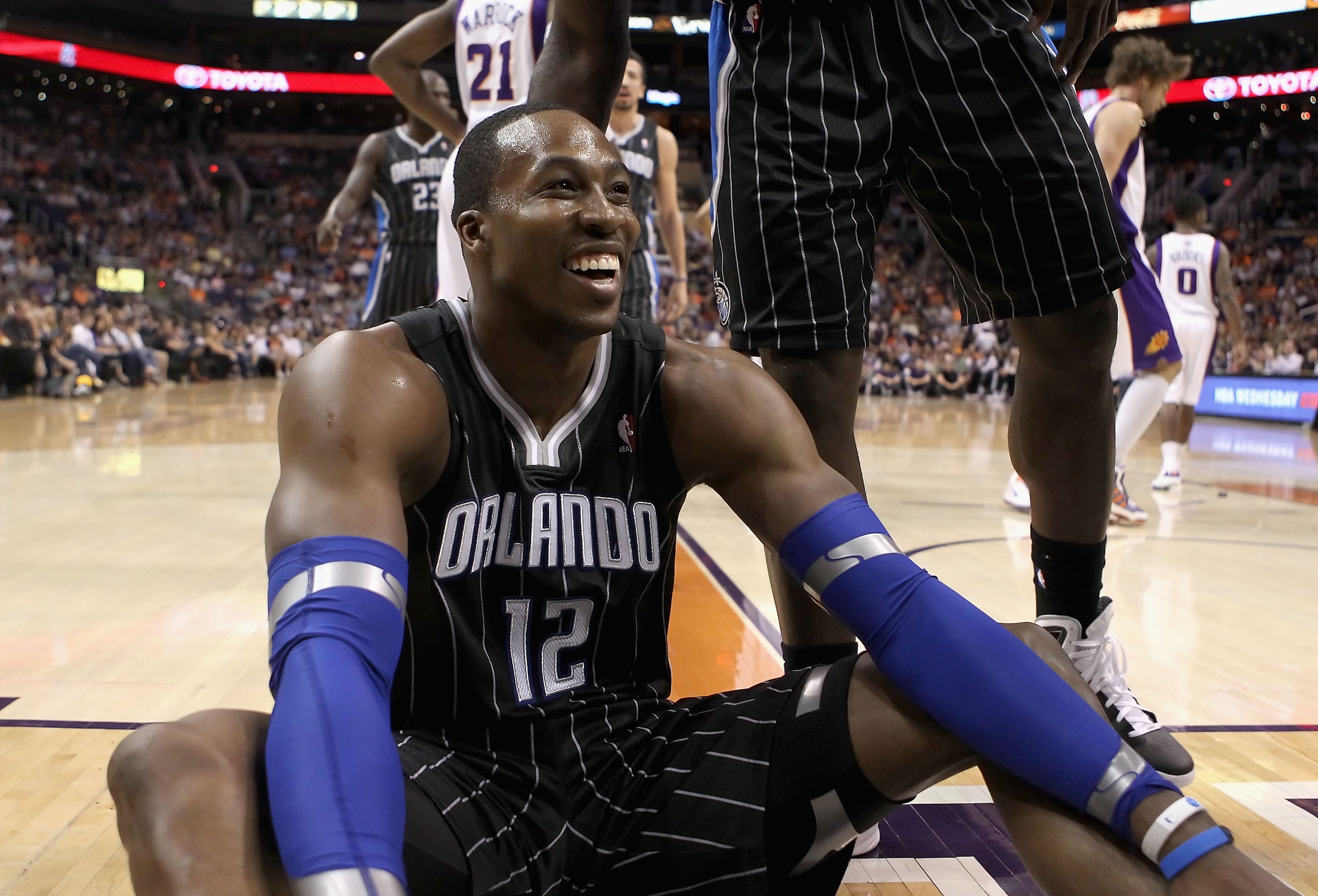 PHOENIX, AZ - MARCH 13: Dwight Howard #12 of the Orlando Magic reacts to a foul call during the NBA game against the Phoenix Suns at US Airways Center on March 13, 2011 in Phoenix, Arizona. The Magic defeated the Suns 111-88. NOTE TO USER: User expressly PHOENIX, AZ - MARCH 13: Dwight Howard #12 of the Orlando Magic reacts to a foul call during the NBA game against the Phoenix Suns at US Airways Center on March 13, 2011 in Phoenix, Arizona. The Magic defeated the Suns 111-88. NOTE TO USER: User expressly