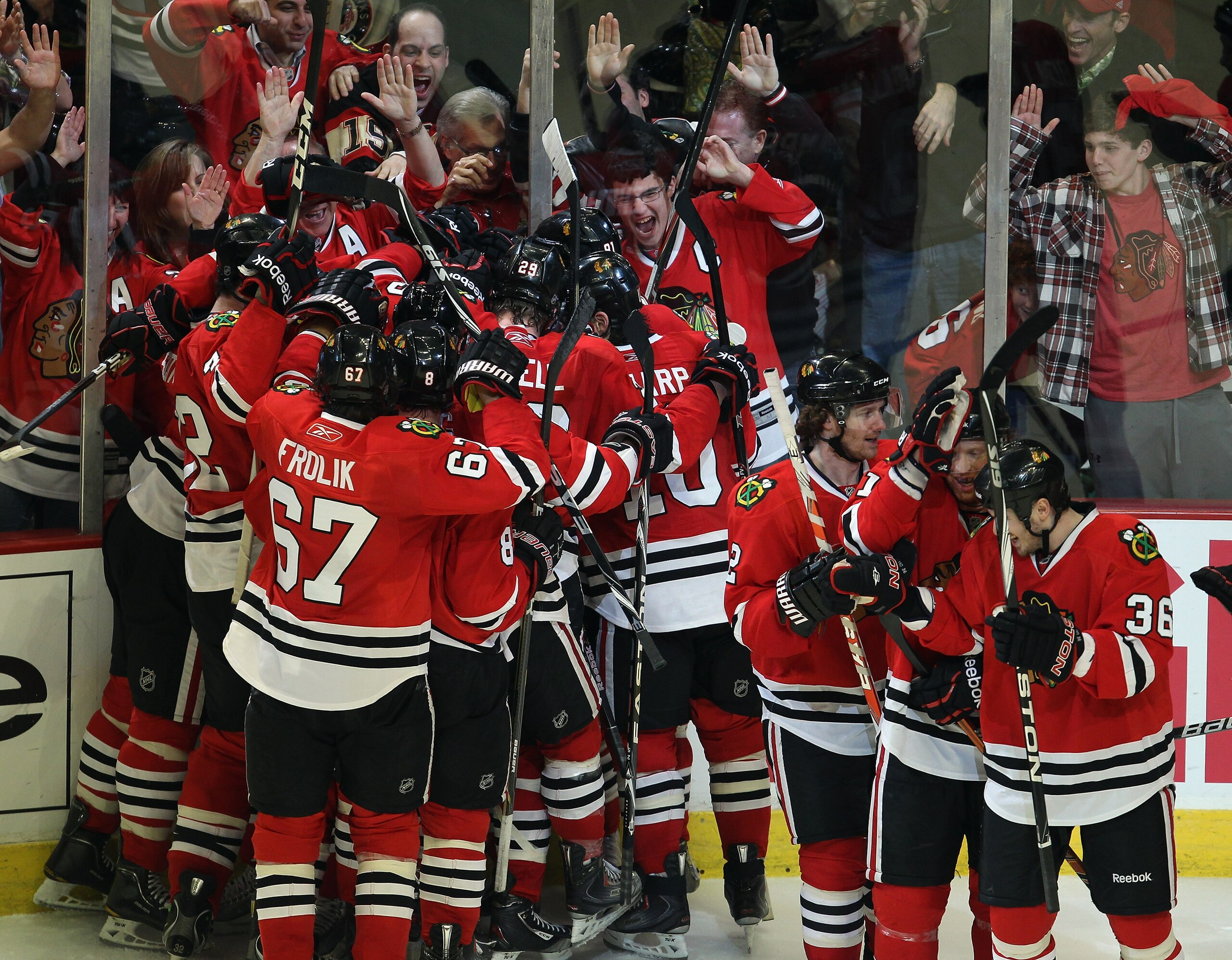 CHICAGO, IL - APRIL 24: Members of the Chicago Blackhawks celebrate an overtime win against the Vancouver Canucks in Game Six of the Western Conference Quarterfinals during the 2011 NHL Stanley Cup Playoffs at the United Center on April 24, 2011 in Chicag