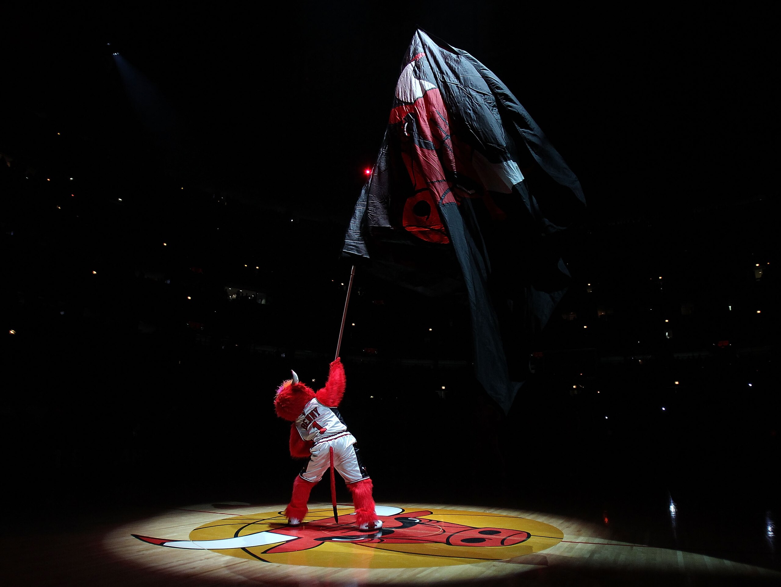 CHICAGO, IL - MARCH 07: Benny, the mascot of the Chicago Bulls, waves a flag before a game against the New Orleans Hornets at the United Center on March 7, 2011 in Chicago, Illinois. The Bulls defeated the Hornets 85-77. NOTE TO USER: User expressly ackno