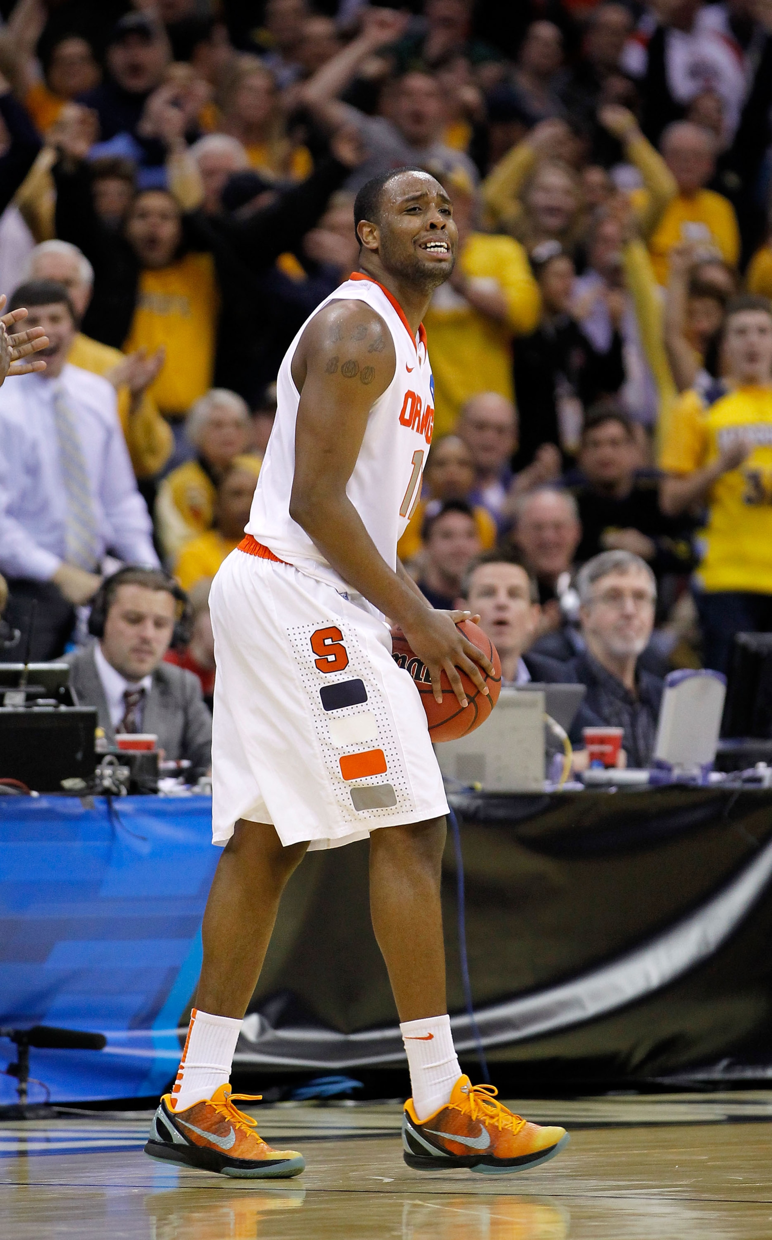 CLEVELAND, OH - MARCH 20: Scoop Jardine #11 of the Syracuse Orange reacts after turning the ball over late in the game against the Marquette Golden Eagles during the third of the 2011 NCAA men's basketball tournament at Quicken Loans Arena on March 20, 20 CLEVELAND, OH - MARCH 20: Scoop Jardine #11 of the Syracuse Orange reacts after turning the ball over late in the game against the Marquette Golden Eagles during the third of the 2011 NCAA men's basketball tournament at Quicken Loans Arena on March 20, 20