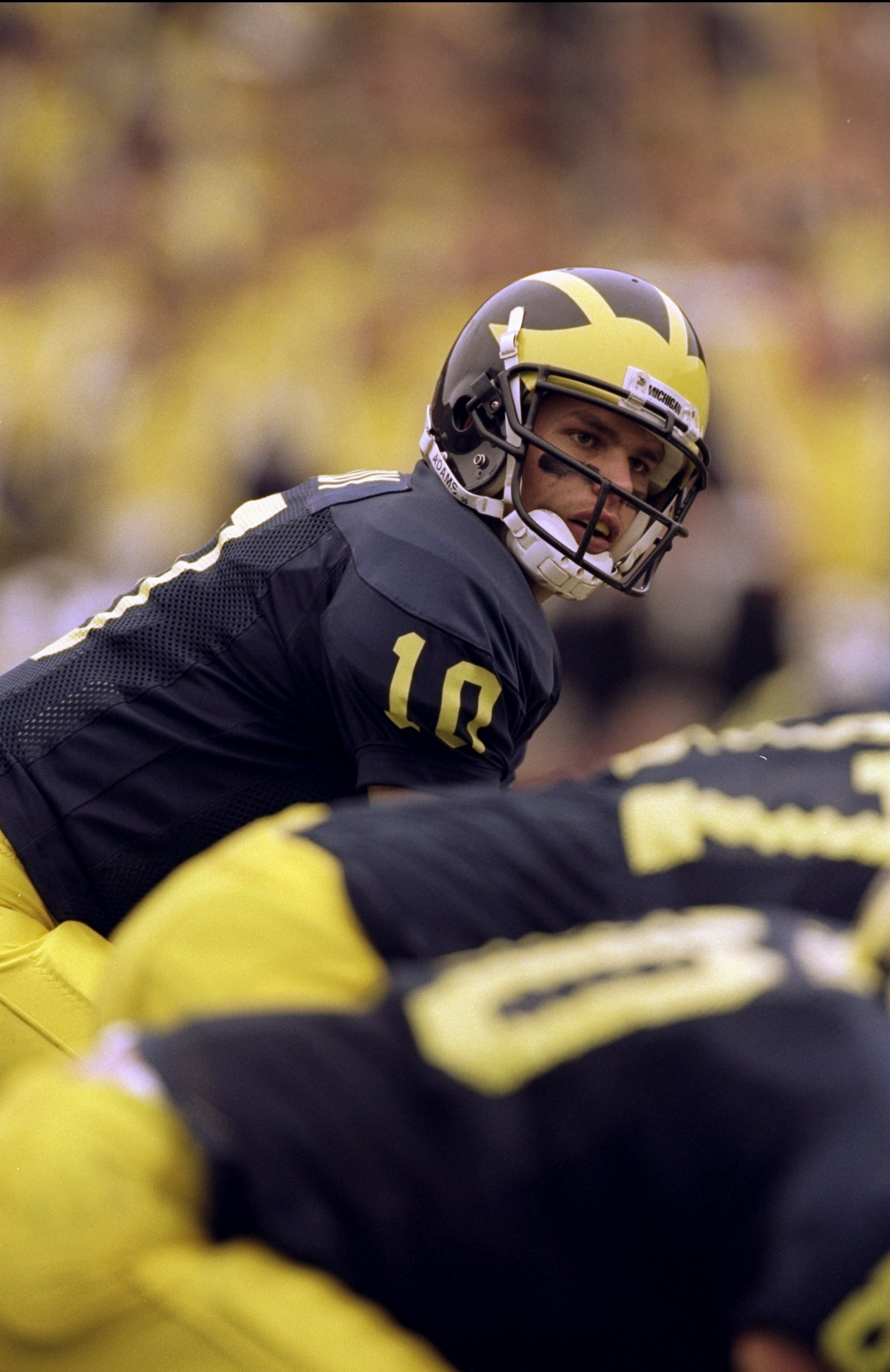 14 Nov 1998:  Quarterback Tom Brady #10 of the Michigan Wolverines  prepares to take the snap during a game against the Wisconsin Badgers at the Michigan Stadium in Ann Arbor, Michigan. The Wolverines defeated the Badgers 27-10. Mandatory Credit: Vincent