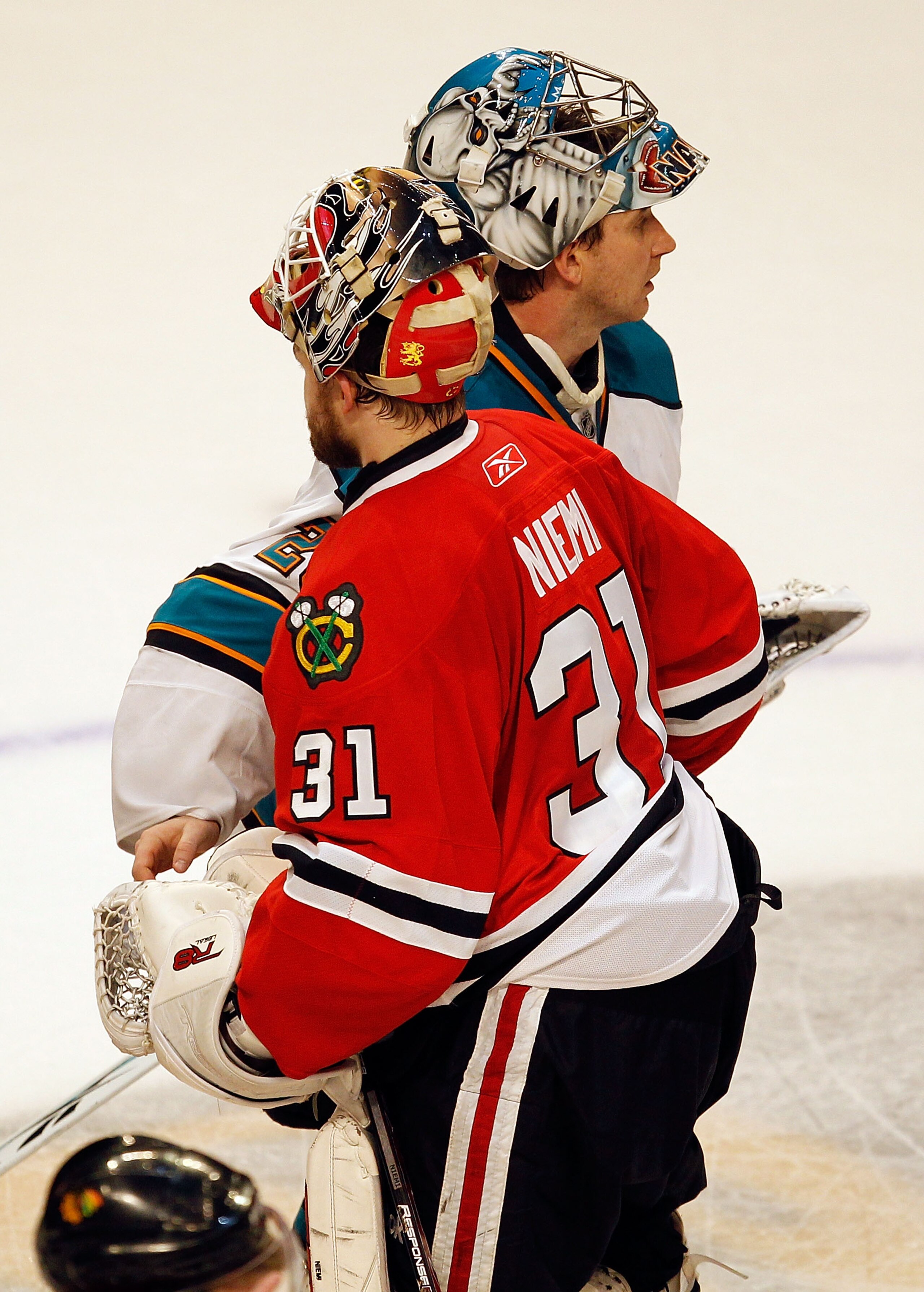 CHICAGO - MAY 23:  Goaltender Antti Niemi #31 of the Chicago Blackhawks shakes hands with Evgeni Nabokov #20 of the San Jose Sharks after the Blackhawks defeated the Sharks 4-2 in Game Four of the Western Conference Finals during the 2010 NHL Stanley Cup
