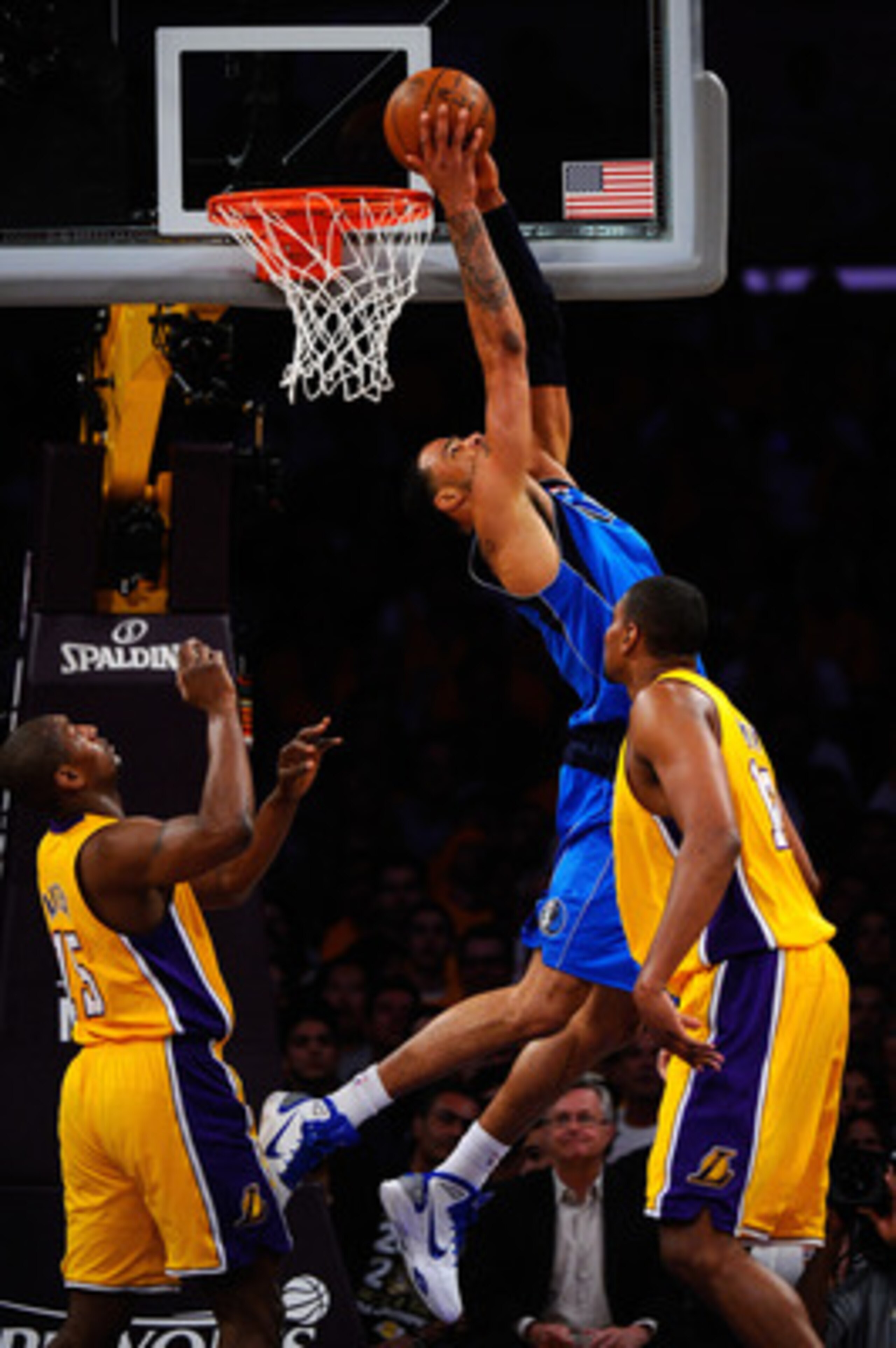 LOS ANGELES, CA - MAY 02:  Tyson Chandler #6 of the Dallas Mavericks dunks the ball over his head as Andrew Bynum #17 of the Los Angeles Lakers looks on in the first quarter of Game One of the Western Conference Semifinals in the 2011 NBA Playoffs at Stap