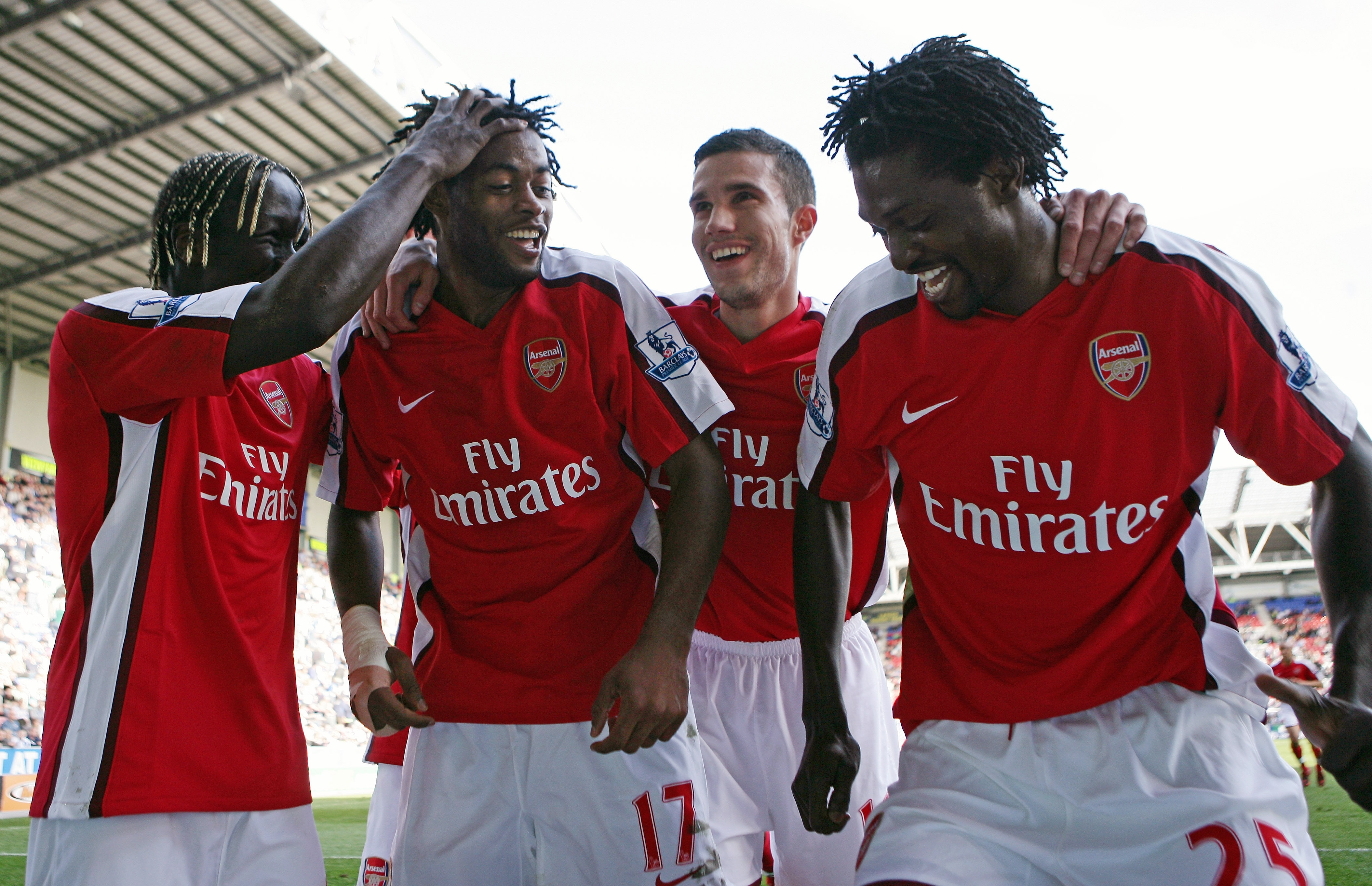 WIGAN, ENGLAND - APRIL 11:  Alexandre Song of Arsenal celebrates scoring the fourth goal with Emmanuel Adebayor during the Barclays Premier League match between Wigan Athletic and Arsenal at The JJB Stadium on April 11, 2009 in Wigan, England.  (Photo by