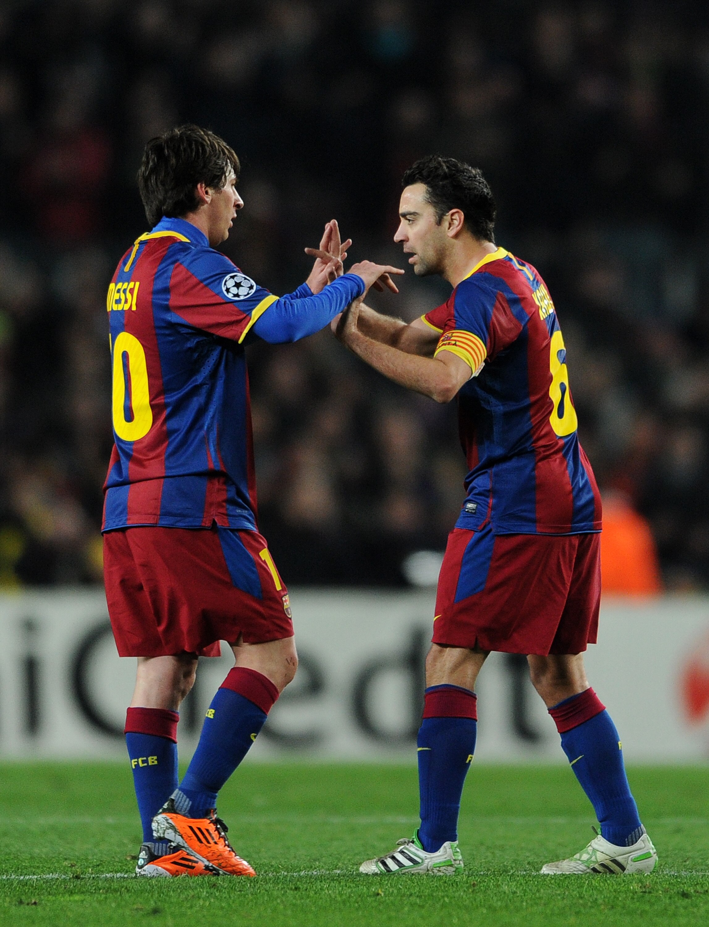 BARCELONA, SPAIN - MARCH 08:  Lionel Messi (L) of Barcelona celebrates with Xavi Hernandez during the UEFA Champions League round of 16 second leg match between Barcelona and Arsenal on March 8, 2011 in Barcelona, Spain.  (Photo by Jasper Juinen/Getty Ima