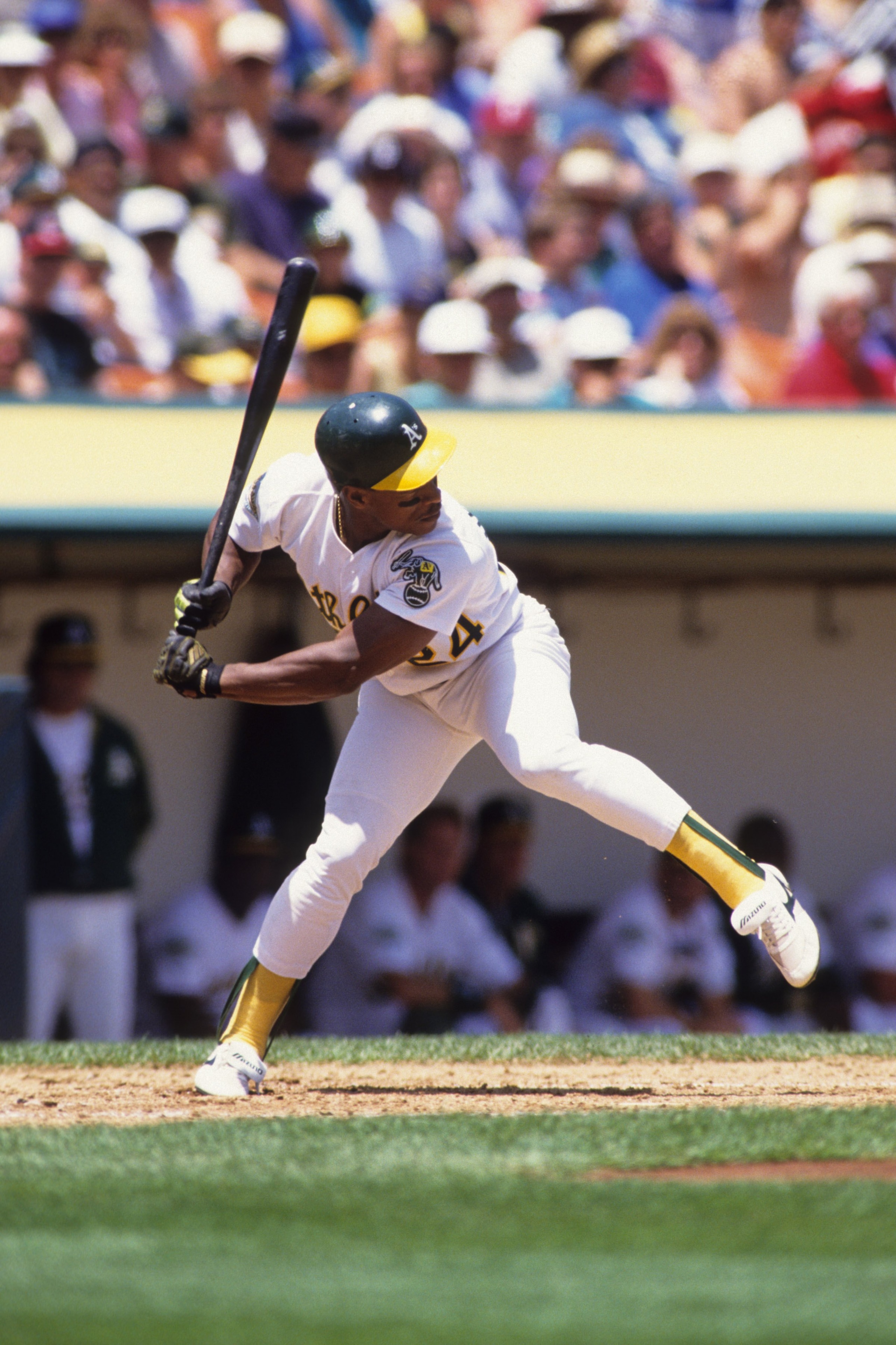 OAKLAND, CA - MAY 1992:  Rickey Henderson #24 of the Oakland Athletics leads off from the bag during their MLB game against the Cleveland Indians circa May 1992 at Oakland-Alameda County Coliseum in Oakland, California. (Photo by Rick Stewart/Getty Images