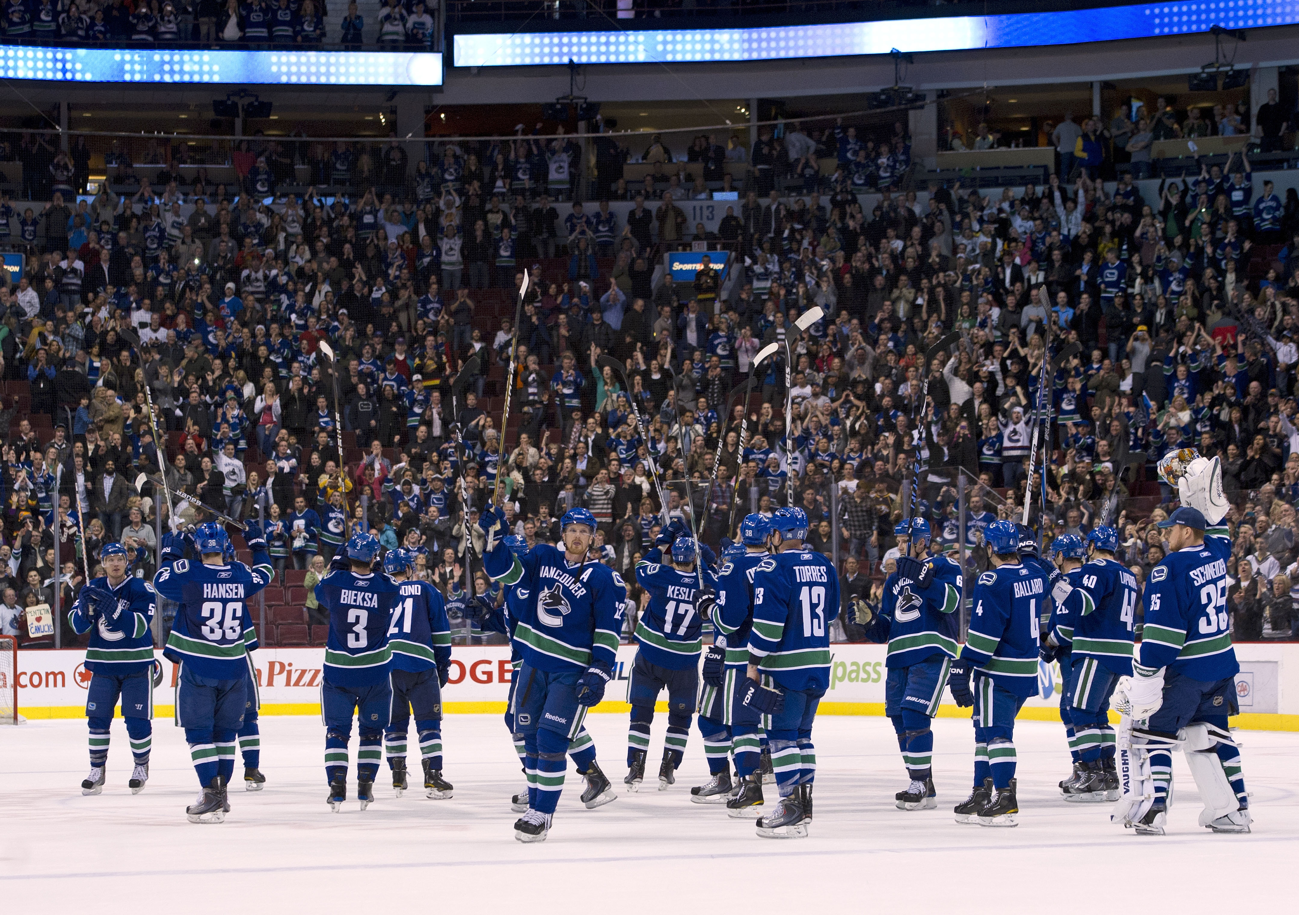 VANCOUVER, CANADA - MARCH 31: The Vancouver Canucks salut their fans after defeating the Los Angeles Kings in NHL action on March 31, 2011 at Rogers Arena in Vancouver, BC, Canada.  (Photo by Rich Lam/Getty Images)
