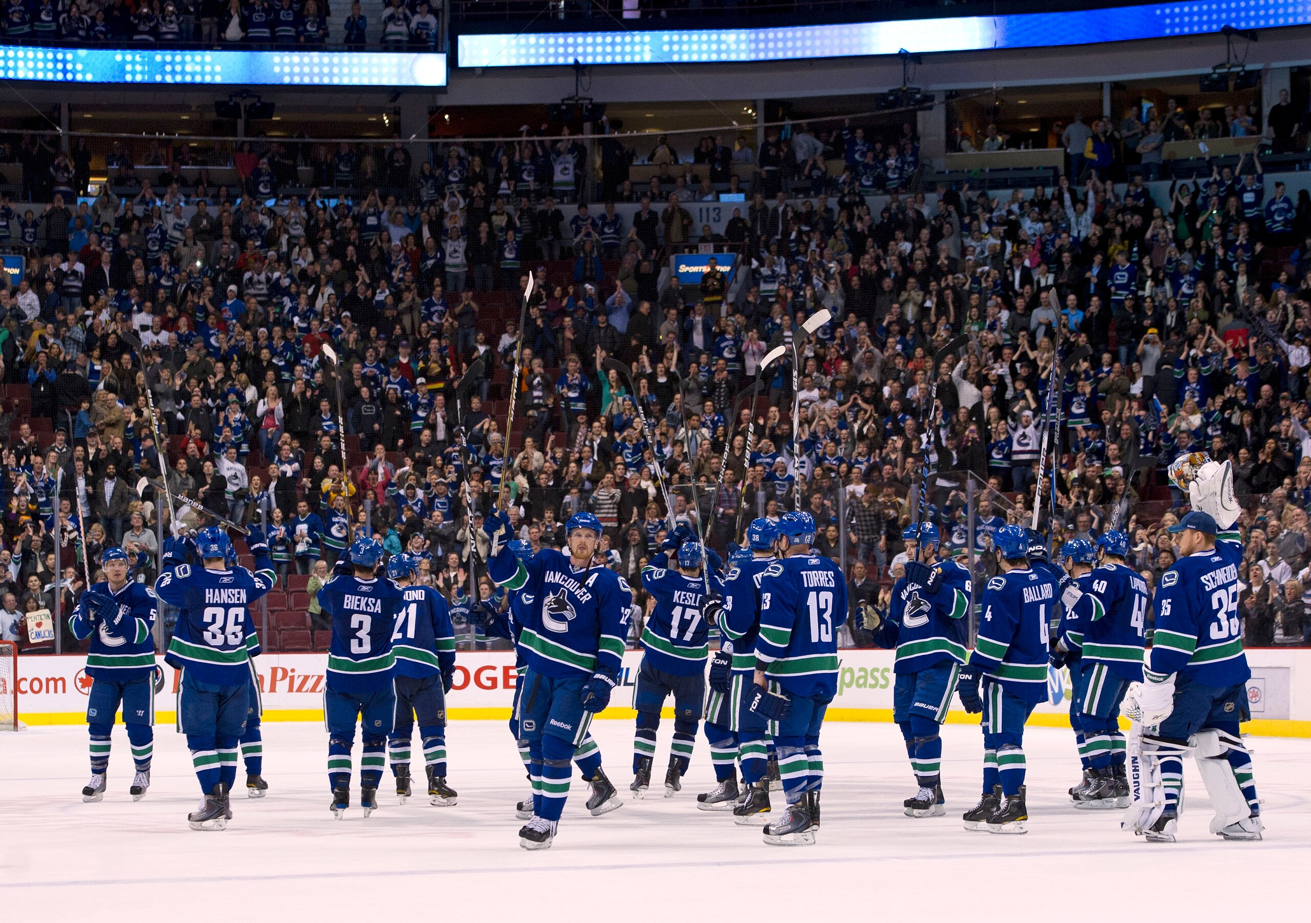 VANCOUVER, CANADA - MARCH 31: The Vancouver Canucks salut their fans after defeating the Los Angeles Kings in NHL action on March 31, 2011 at Rogers Arena in Vancouver, BC, Canada.  (Photo by Rich Lam/Getty Images)