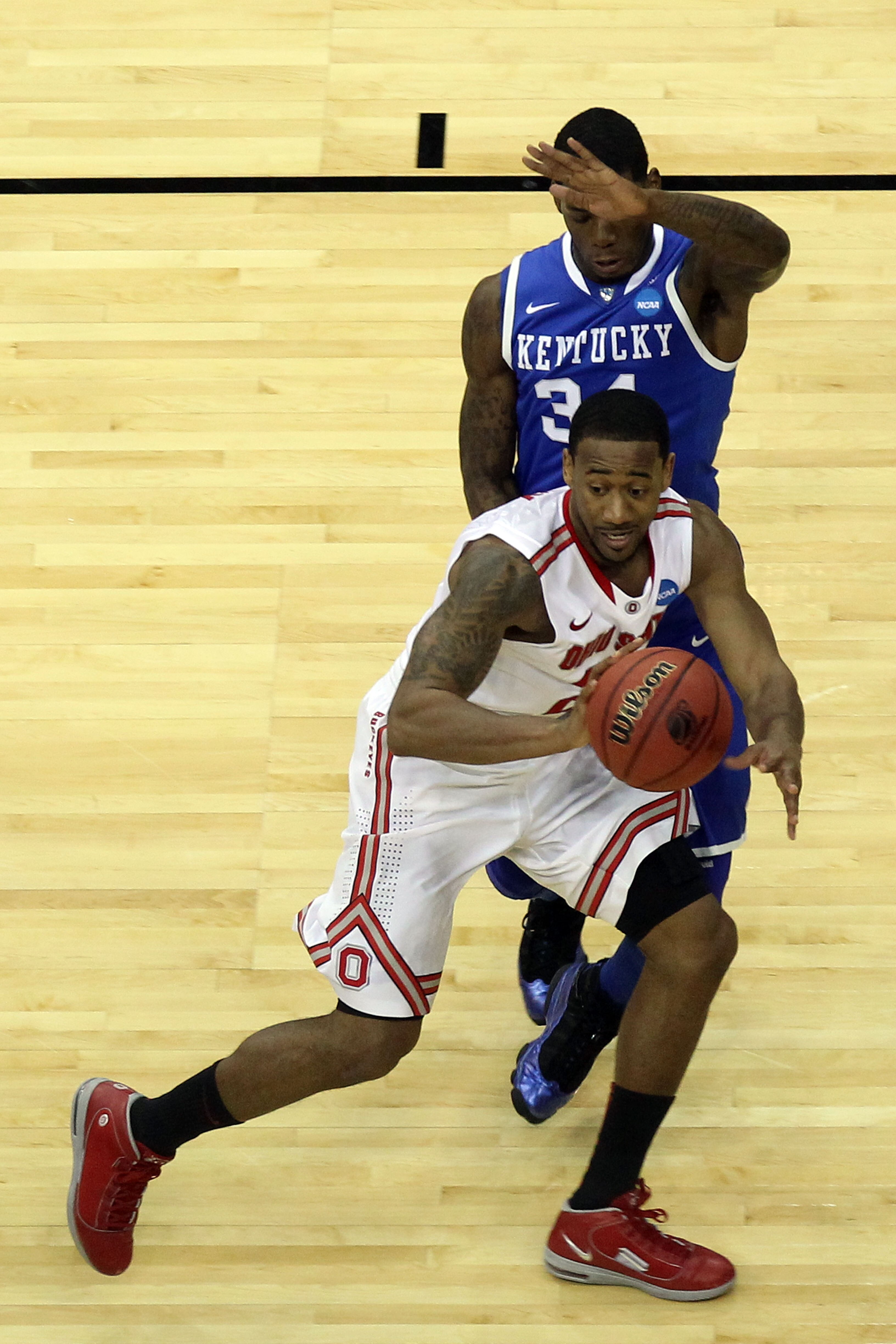 NEWARK, NJ - MARCH 25:  David Lighty #23 of the Ohio State Buckeyes in action against DeAndre Liggins #34 of the Kentucky Wildcats during the east regional semifinal of the 2011 NCAA Men's Basketball Tournament at the Prudential Center on March 25, 2011 i