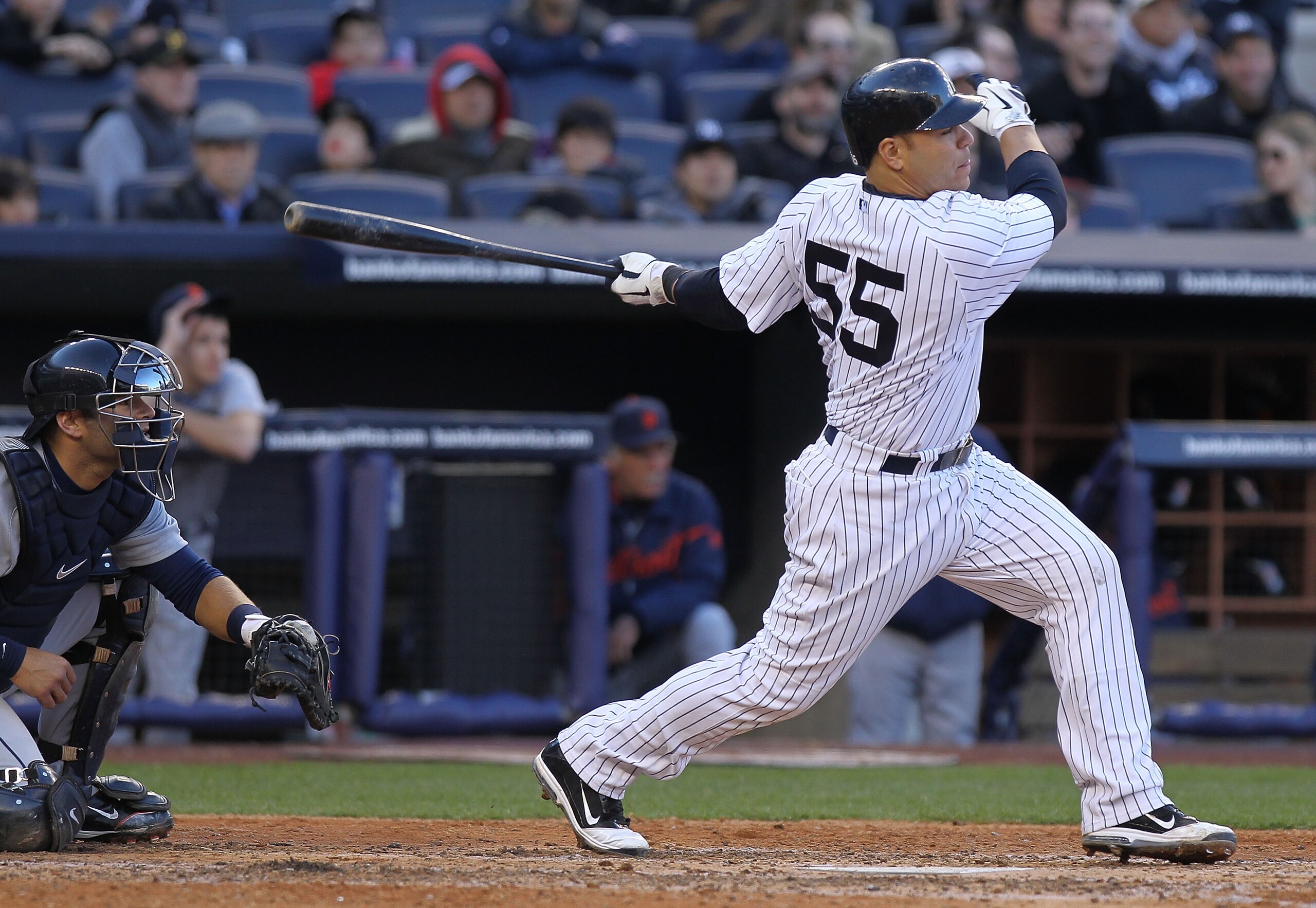 NEW YORK, NY - APRIL 02:  Russell Martin #55 of the New York Yankees hits a 3 RBI homerun in the fifth inning against the Detroit Tigers at Yankee Stadium on April 2, 2011 in the Bronx borough of New York City.  (Photo by Nick Laham/Getty Images)