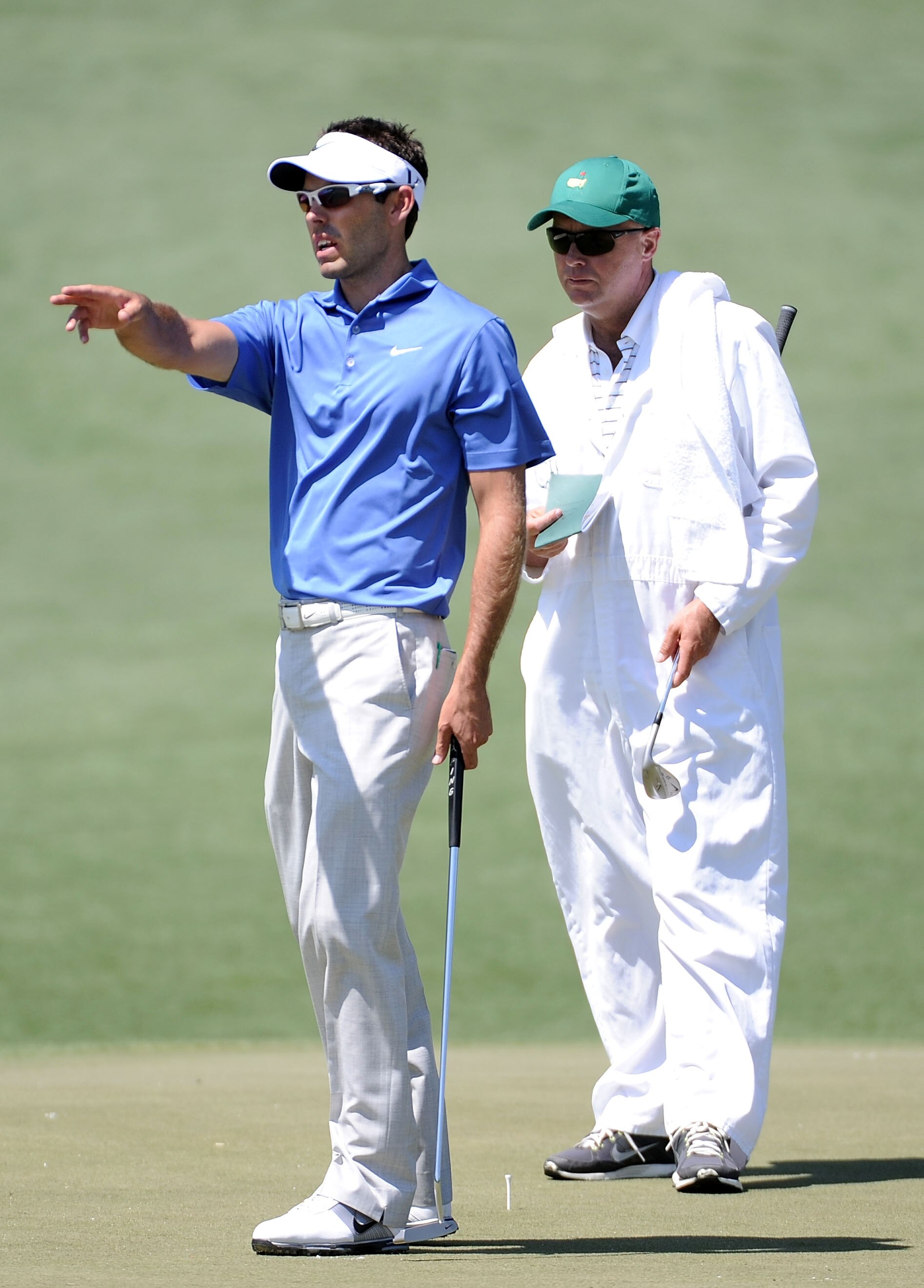 AUGUSTA, GA - APRIL 04:  Charl Schwartzel of South Africa chats with his caddie during a practice round prior to the 2011 Masters Tournament at Augusta National Golf Club on April 4, 2011 in Augusta, Georgia.  (Photo by Harry How/Getty Images)