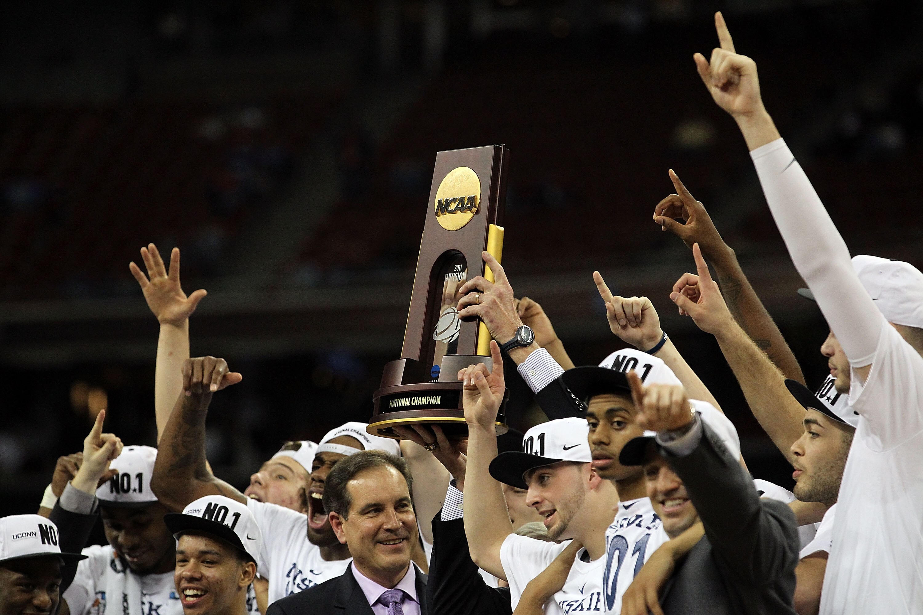 HOUSTON, TX - APRIL 04:  The Connecticut Huskies hoist the Championship Trophy after defeated the Butler Bulldogs during the National Championship Game of the 2011 NCAA Division I Men's Basketball Tournament at Reliant Stadium on April 4, 2011 in Houston,