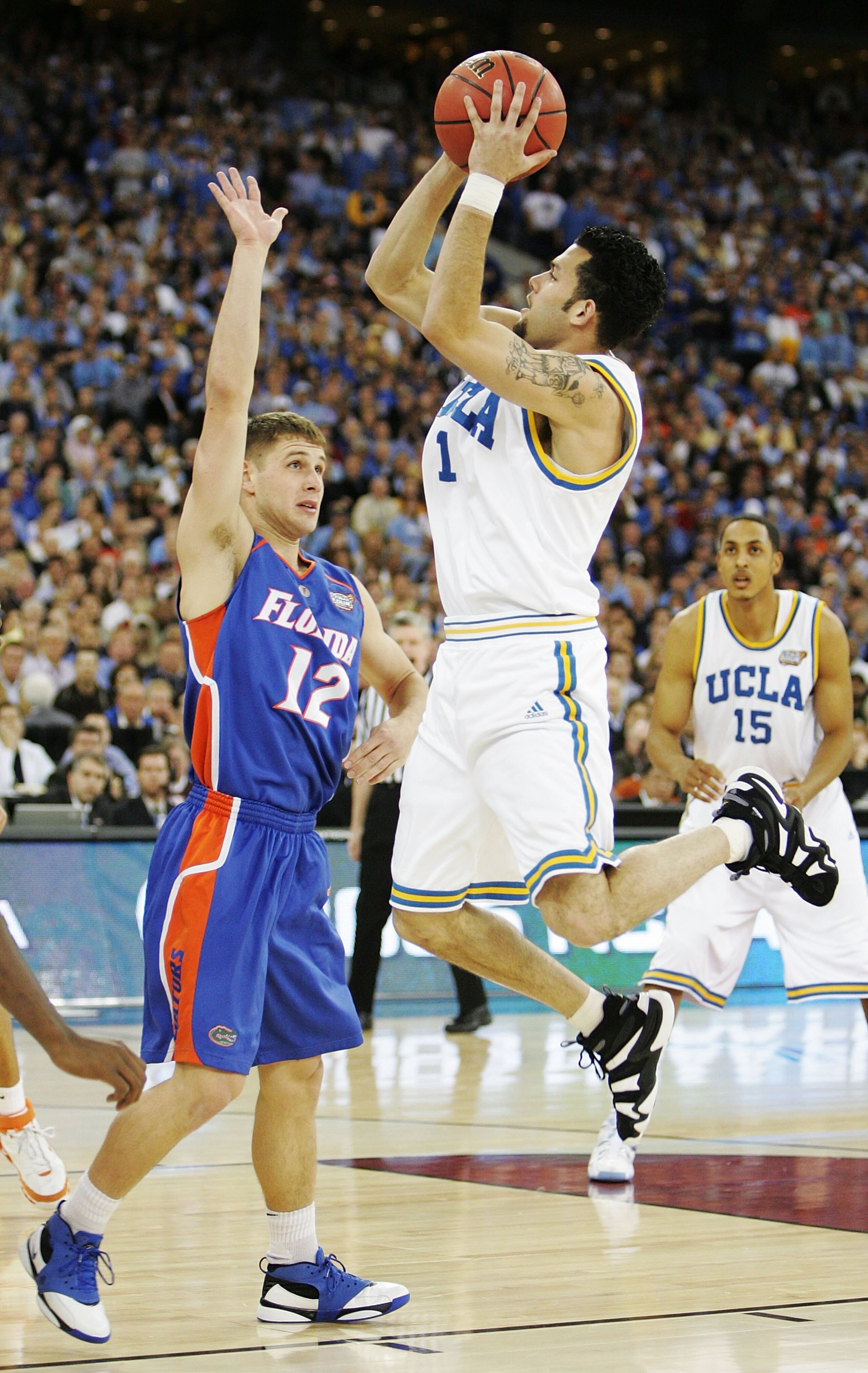 INDIANAPOLIS - APRIL 3:  Jordan Farmar #1 of the UCLA Bruins shoots over Lee Humphrey #12 of the Florida Gators in the first half during the National Championship game of the NCAA Men's Final Four on April 3, 2006 at the RCA Dome in Indianapolis, Indiana.