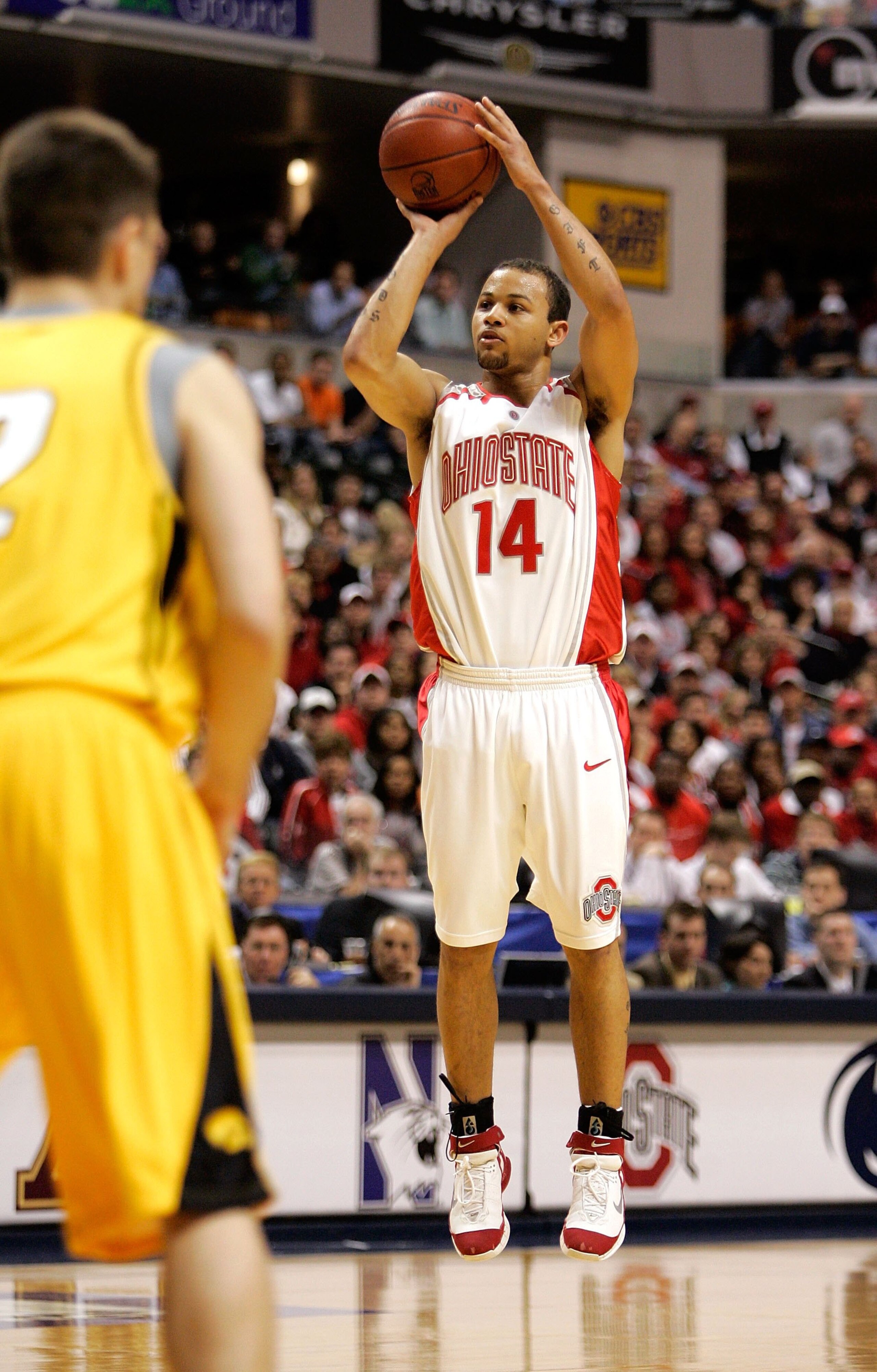 INDIANAPOLIS - MARCH 12:  Jamar Butler #14 of the Ohio State Buckeyes shoots over Jeff Horner #2 of the Iowa Hawkeyes during the Big 10 Tournament Championship game on March 12, 2006 at Conseco Fieldhouse in Indianapolis, Indiana.  (Photo by Brian Bahr/Ge