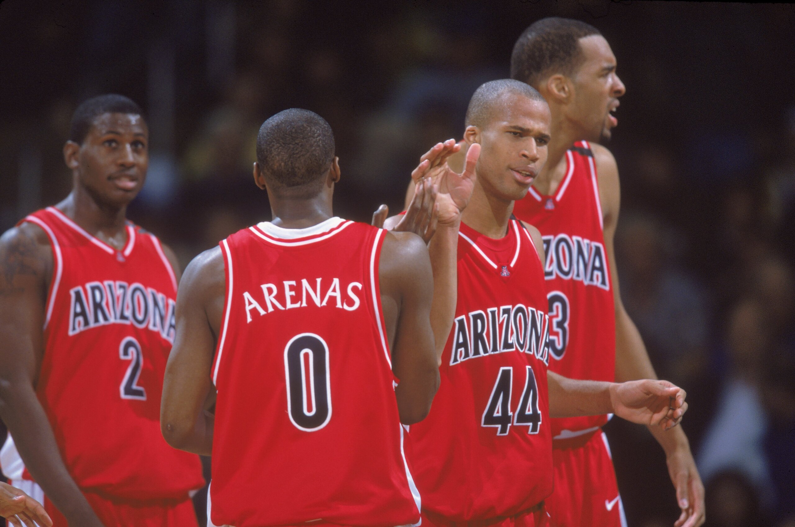 15 Feb 2001:  Gilbert Arenas #9 of the Arizona Wildcats congratulates teammates Michael Wright #2, Richard Jefferson #44, Loren Woods #3 during the game against the University of California, Los Angeles (UCLA) Bruins at the Pauley Pavilion in Los Angeles,