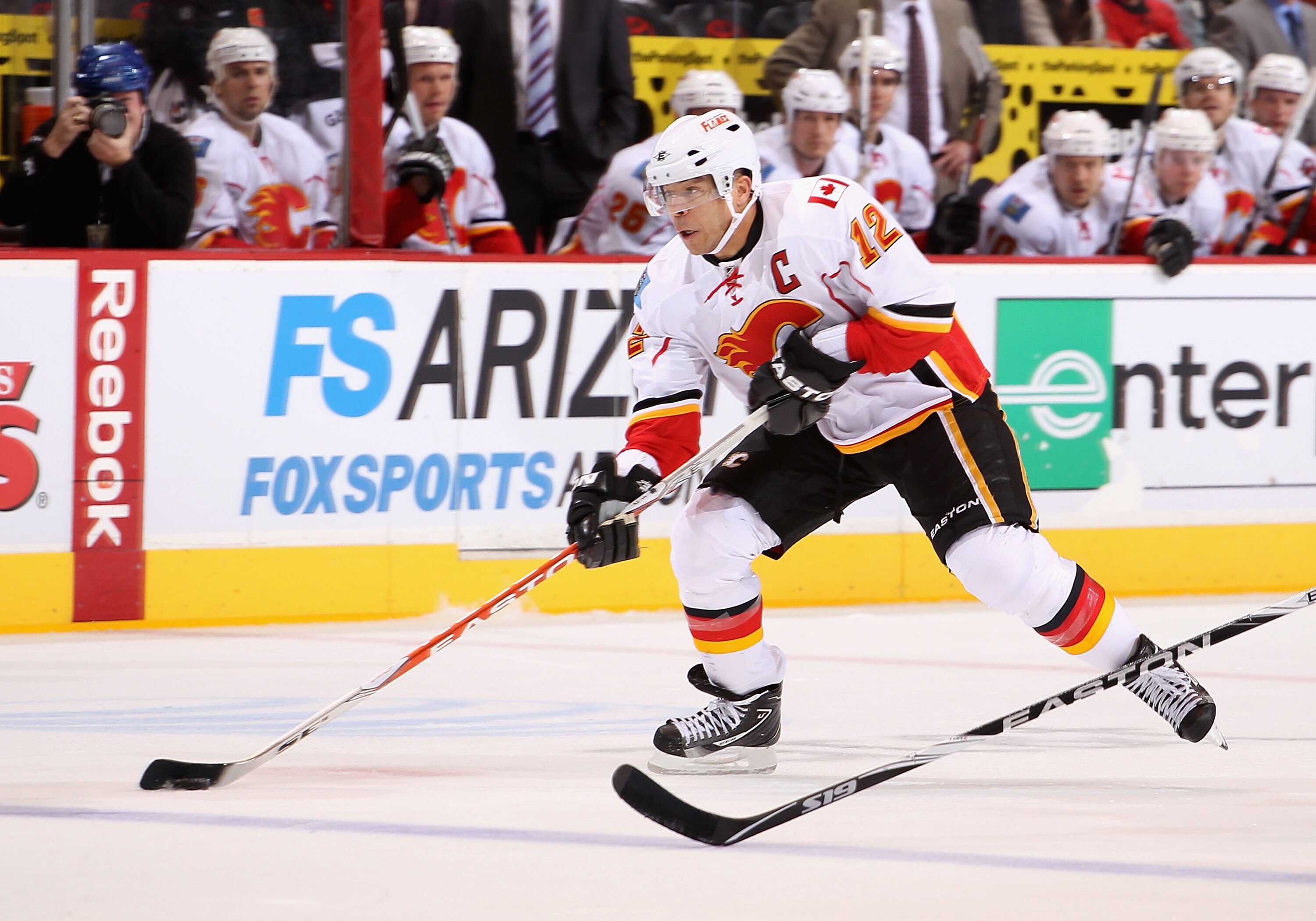 GLENDALE, AZ - MARCH 10:  Jarome Iginla #12 of the Calgary Flames skates with the puck during the NHL game against the Phoenix Coyotes at Jobing.com Arena on March 10, 2011 in Glendale, Arizona.  The Coyotes defeated the Flames 3-0.  (Photo by Christian P