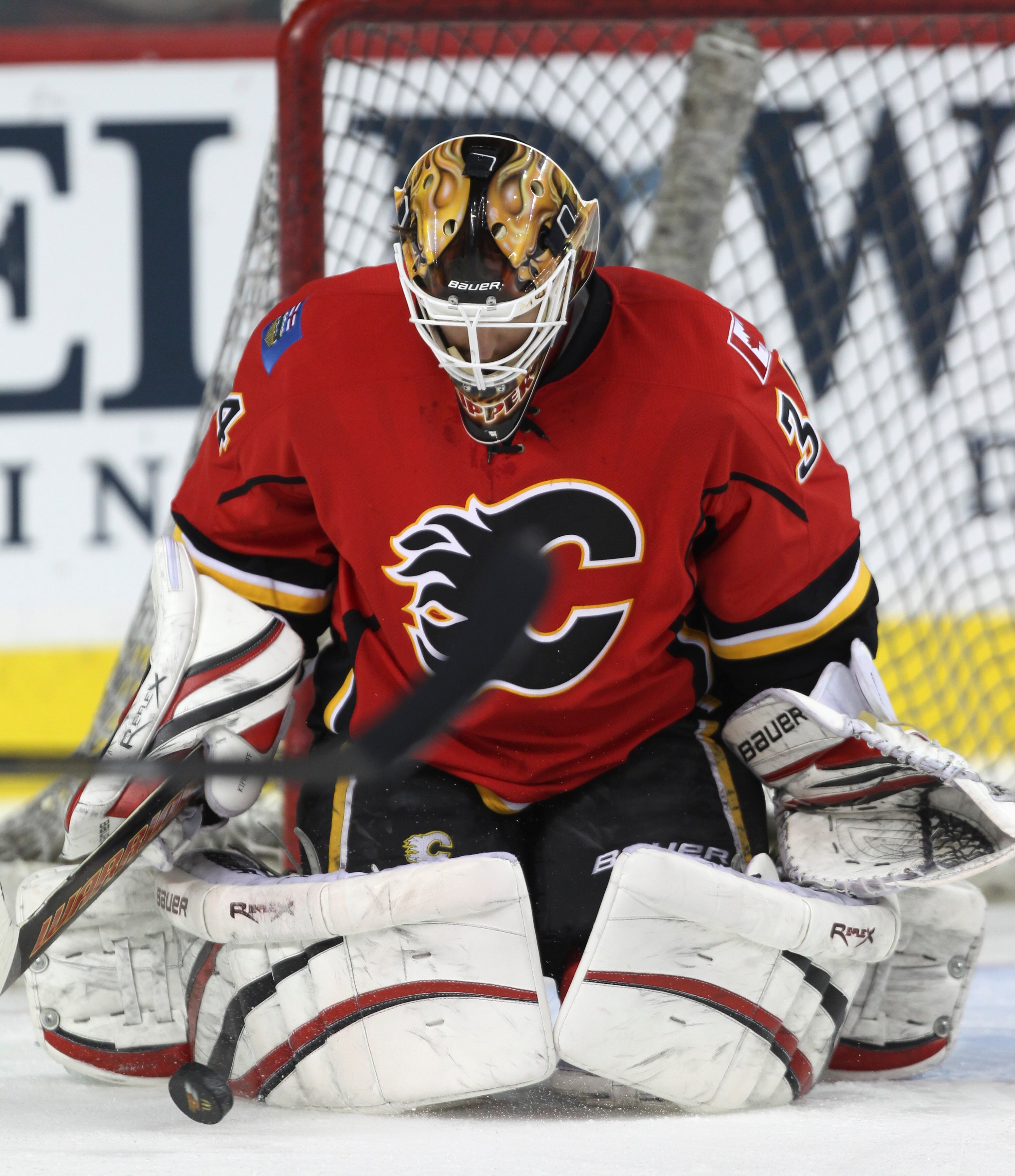 CALGARY, CANADA - MARCH 04: Miikka Kiprusoff #34 of the Calgary Flames makes a save in the warm up before NHL action against the Columbus Blue Jackets on March 4, 2011 at the Scotiabank Saddledome in Calgary, Alberta, Canada. (Photo by Mike Ridewood/Getty