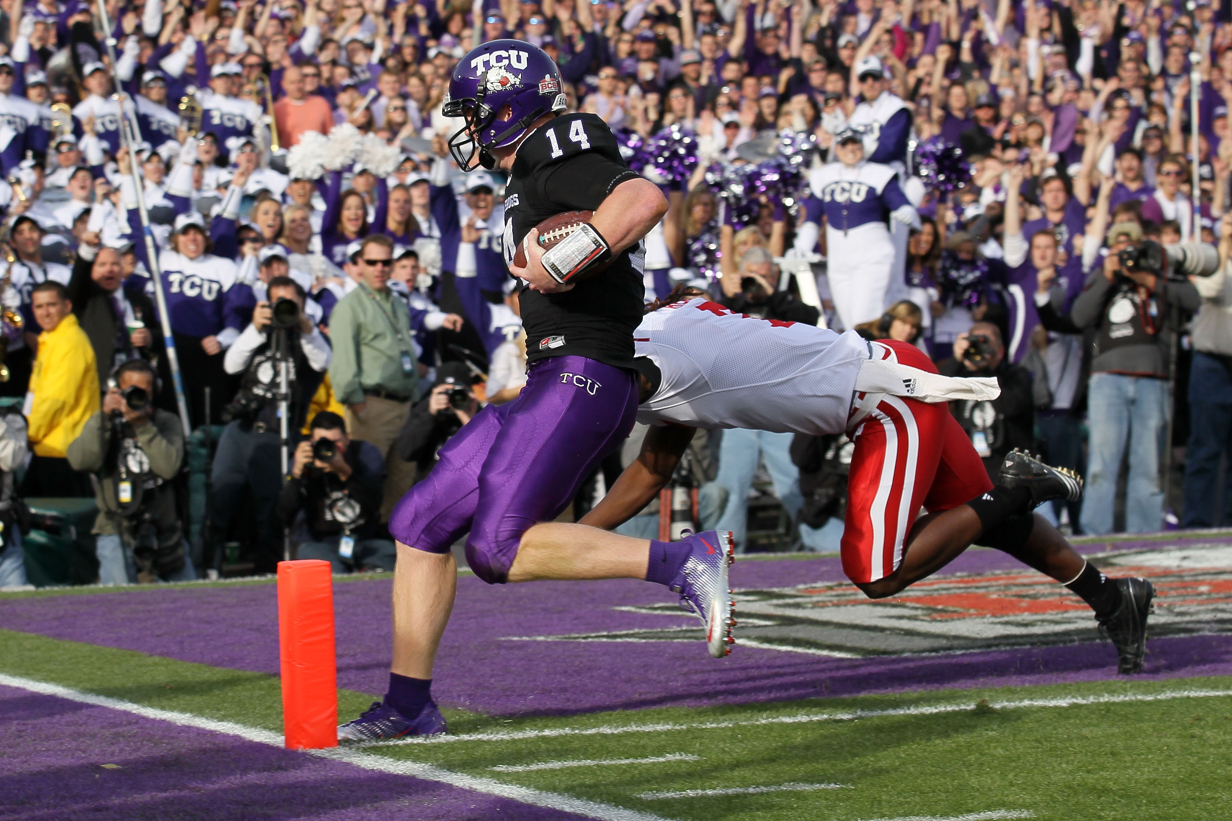 PASADENA, CA - JANUARY 01:  Quarterback Andy Dalton #14 of the TCU Horned Frogs scores a touchdown against the Wisconsin Badgers in the first quarter of the 97th Rose Bowl game on January 1, 2011 in Pasadena, California.  (Photo by Stephen Dunn/Getty Imag