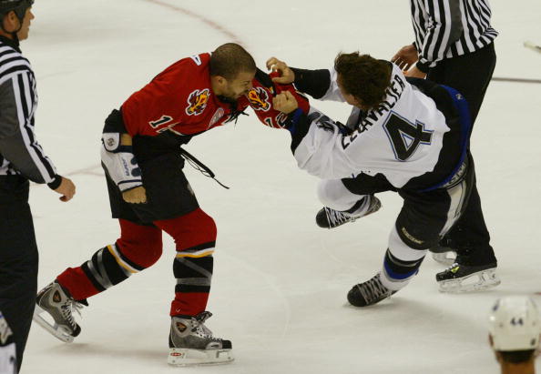 CALGARY, AB - MAY 29:  Right wing Jarome Iginla #12 of the Calgary Flames fights with center Vincent Lecavalier #4 of the Tampa Bay Lightning in Game three of the NHL Stanley Cup Finals at the Pengrowth Saddledome on May 29, 2004 in Calgary, Canada.  The