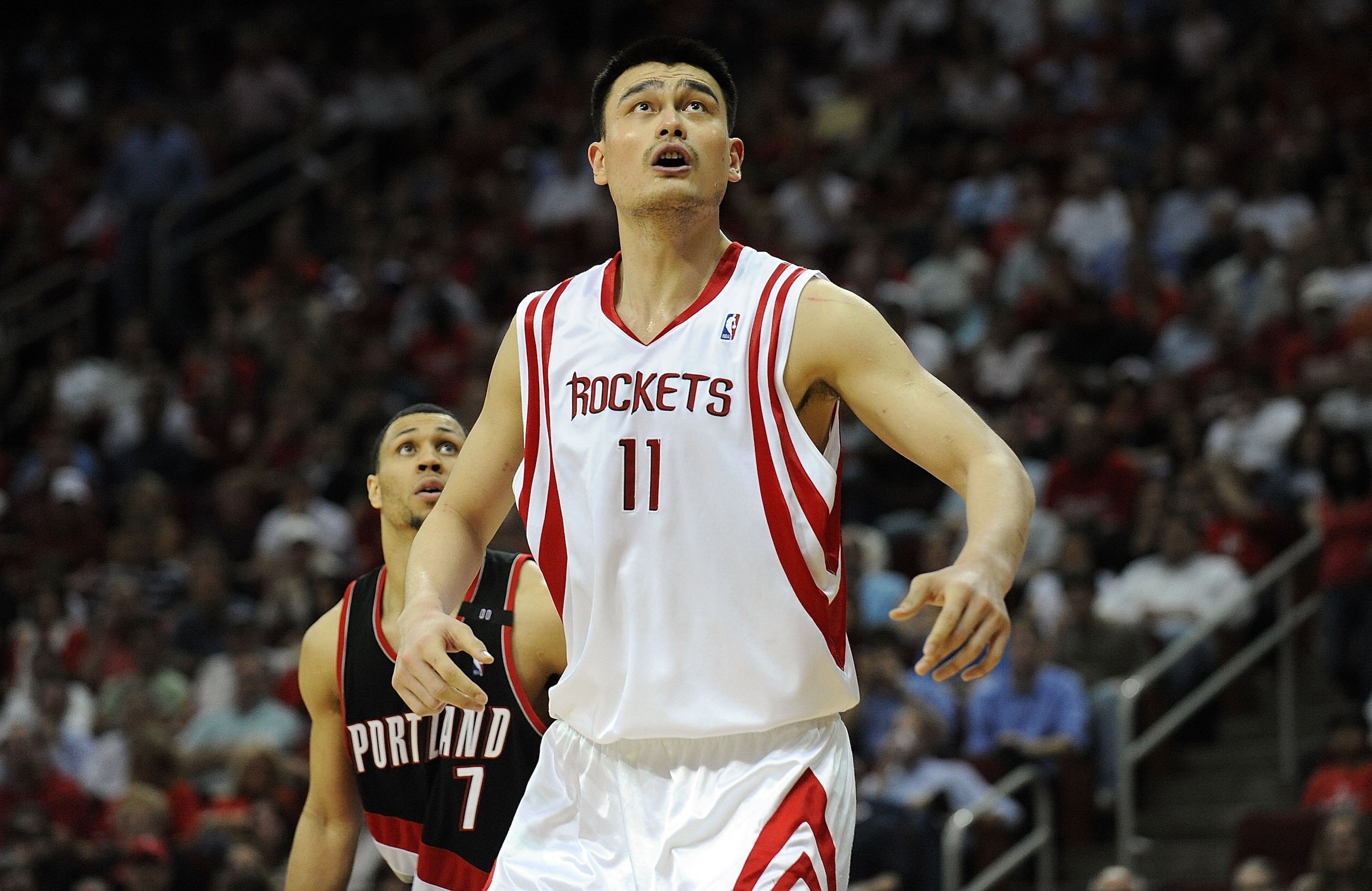 HOUSTON - APRIL 30:  Center Yao Ming #11 of the Houston Rockets and Brandon Roy #7 of the Portland Trail Blazers in Game Six of the Western Conference Quarterfinals during the 2009 NBA Playoffs at Toyota Center on April 30, 2009 in Houston, Texas. NOTE TO
