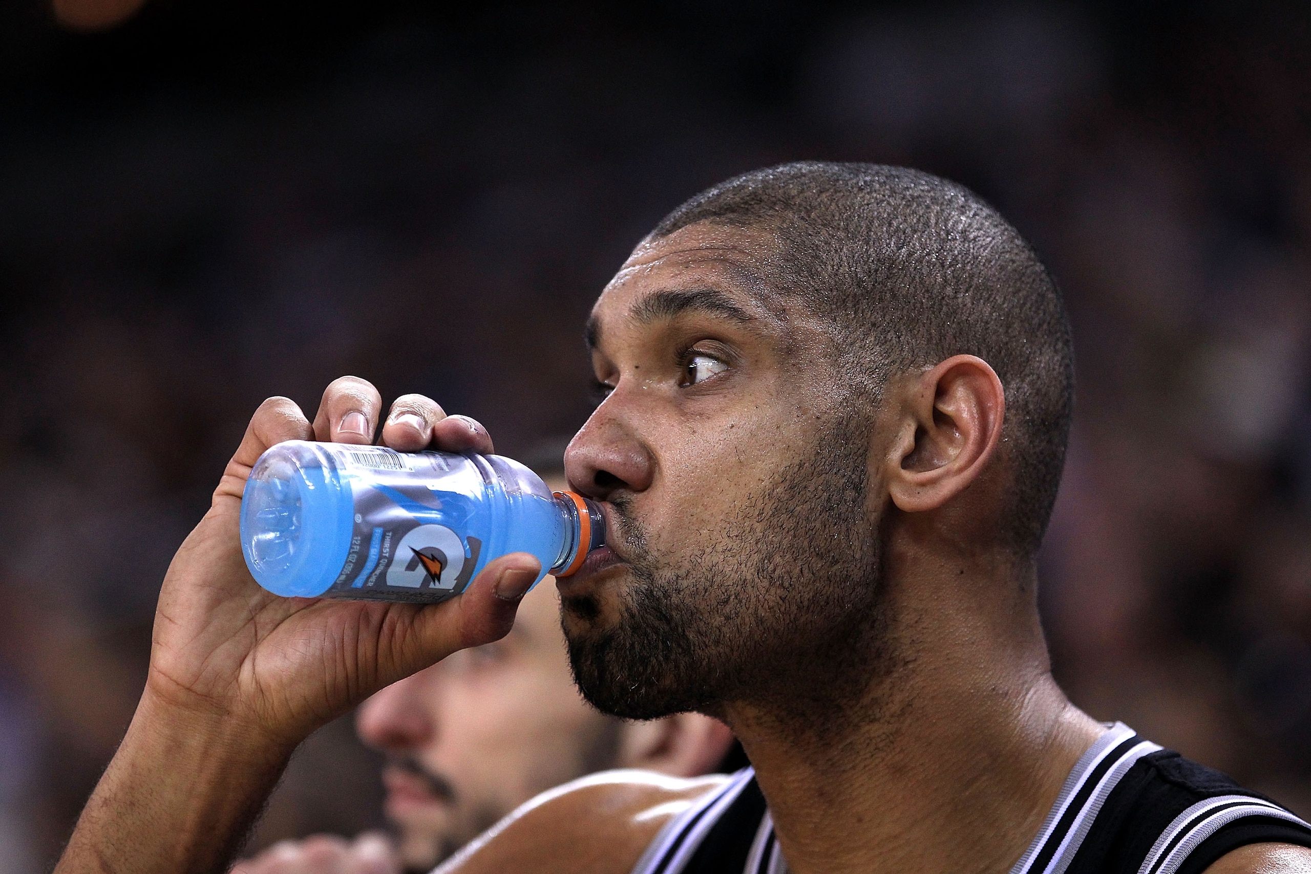 OAKLAND, CA - JANUARY 24:  Tim Duncan #21 of the San Antonio Spurs drinks a Gatorade while sitting on the bench during their game against the Golden State Warriors at Oracle Arena on January 24, 2011 in Oakland, California.  NOTE TO USER: User expressly a