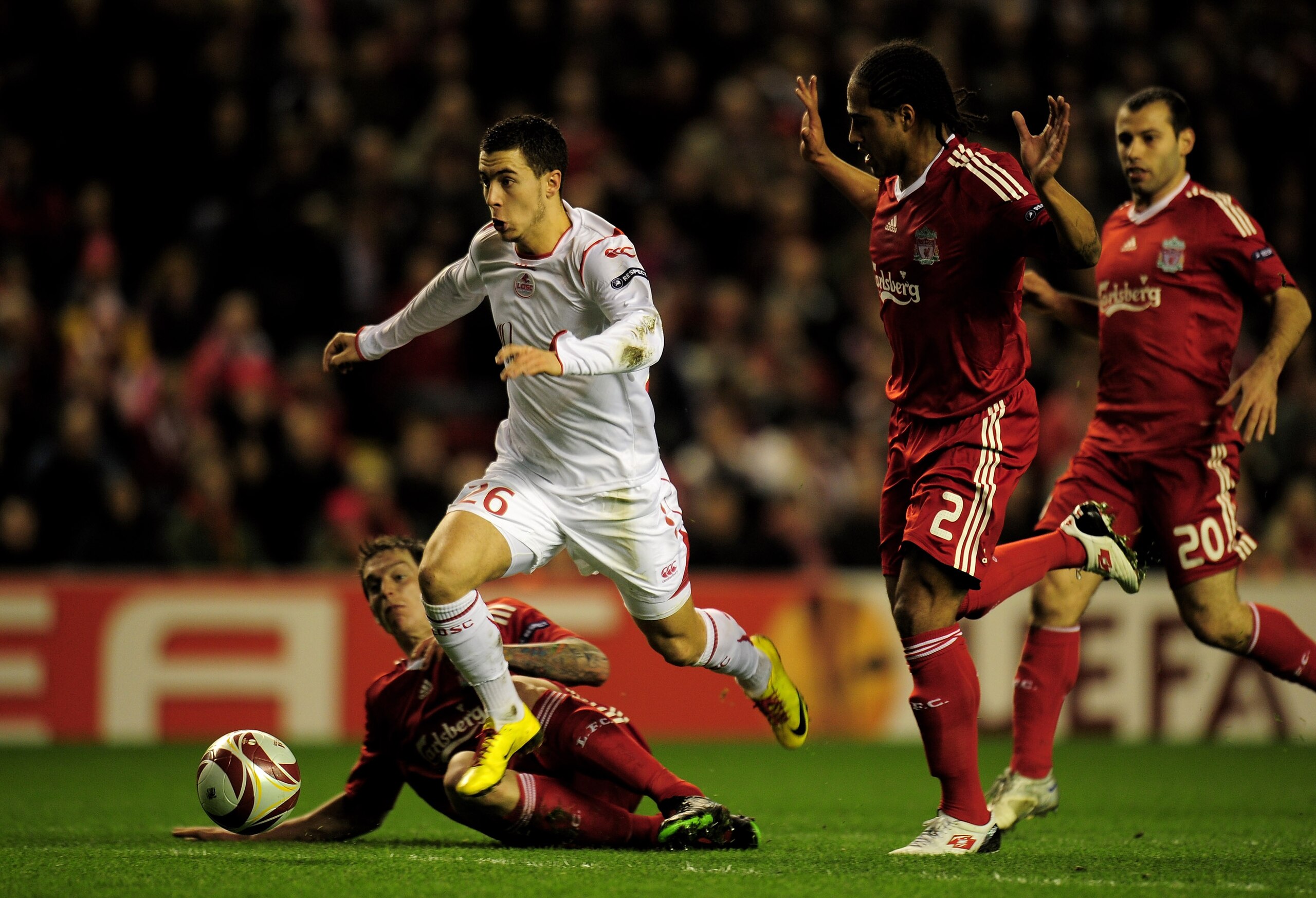 LIVERPOOL, ENGLAND - MARCH 18: Eden Hazard of Lille breaks clear of the challenges of Daniel Agger and Glen Johnson (R) of Liverpool during the UEFA Europa League Round of 16, second leg match at Anfield on March 18, 2010 in Liverpool, England. (Photo b LIVERPOOL, ENGLAND - MARCH 18: Eden Hazard of Lille breaks clear of the challenges of Daniel Agger and Glen Johnson (R) of Liverpool during the UEFA Europa League Round of 16, second leg match at Anfield on March 18, 2010 in Liverpool, England. (Photo b