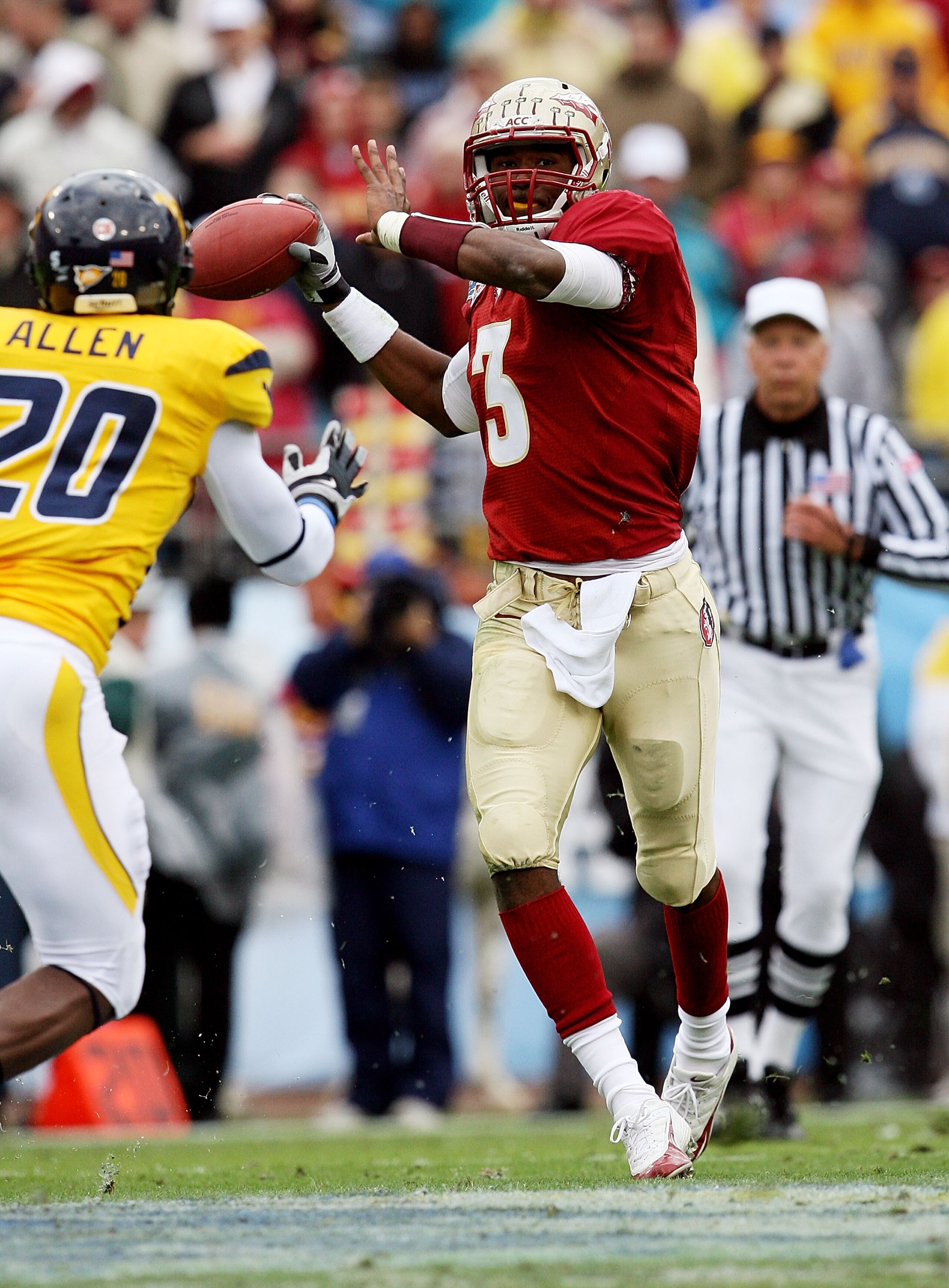JACKSONVILLE, FL - JANUARY 01:  Quarterback E.J. Manuel #3 of the Florida State Seminoles throws a pass over defensive back Franchot Allen #20 of the West Virginia Mountaineers during the Konica Minolta Gator Bowl at Municipal Stadium on January 1, 2010 i