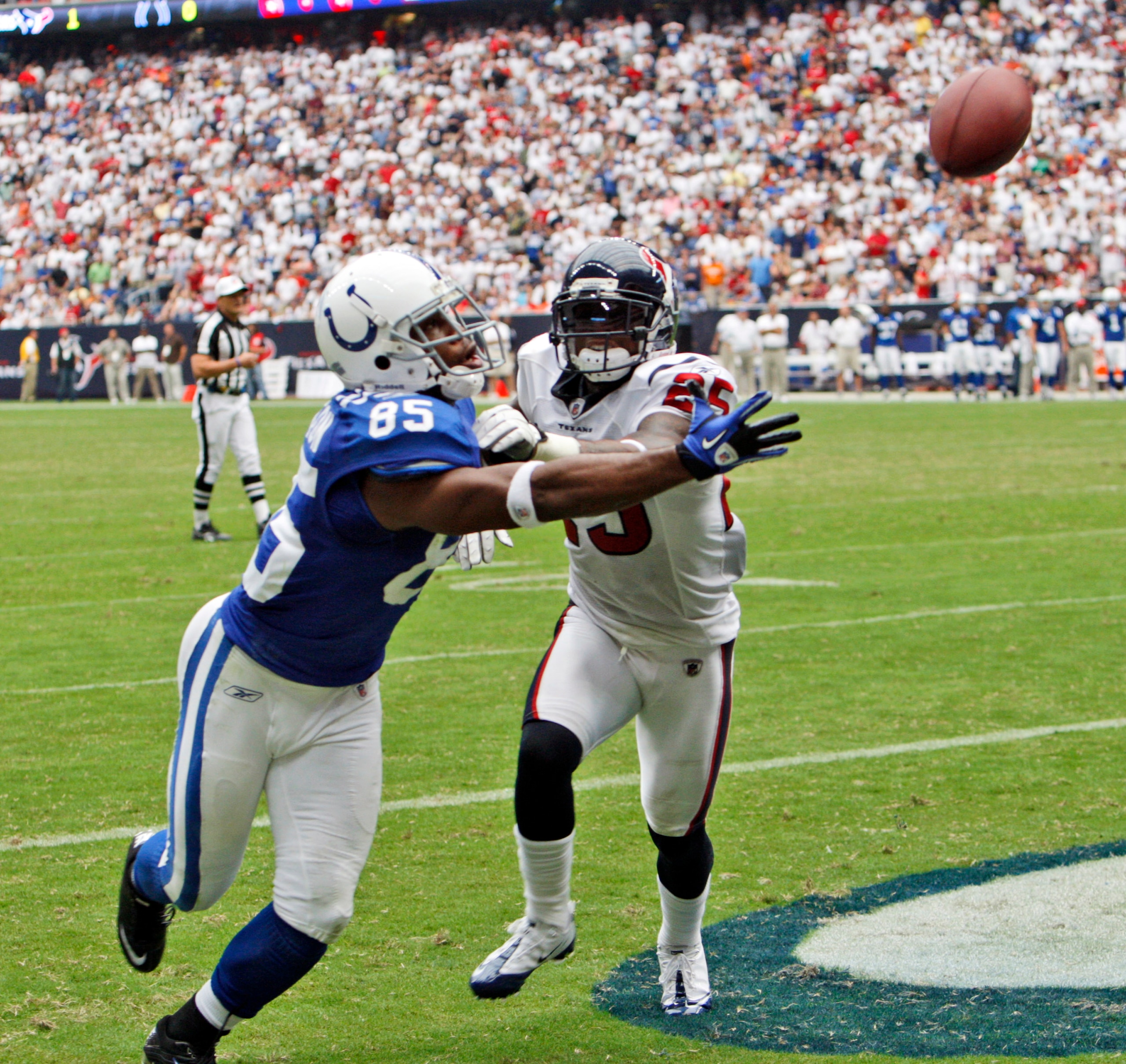 HOUSTON - SEPTEMBER 12:  Wide receiver Pierre Garcon #85 of the Indianapolis Colts can't come up with the catch as cornerback Kareem Jackson #25 of the Houston Texans defends on the play during the NFL season opener at Reliant Stadium on September 12, 201