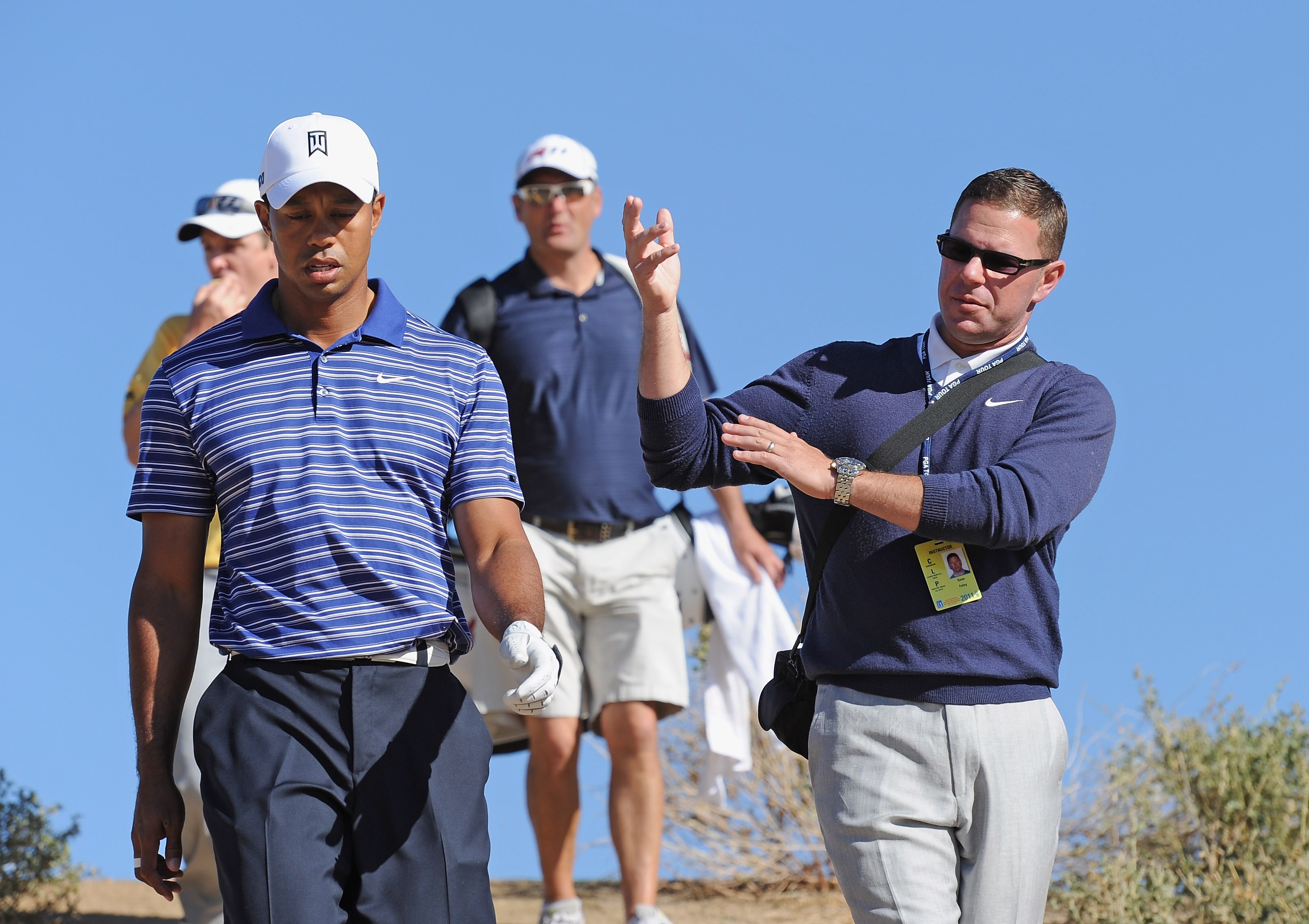 MARANA, AZ - FEBRUARY 22:  Tiger Woods talks with coach Sean Foley during practice prior to the start of the World Golf Championships-Accenture Match Play Championship held at The Ritz-Carlton Golf Club, Dove Mountain on February 22, 2011 in Marana, Arizo