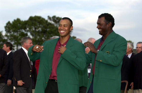 8 Apr 2001:  Tiger Woods of the USA is presented with his second green jacket by defending champion Vijay Singh of Fiji after the final day of the 2001 Masters at the Augusta National Golf Club, Augusta, GA, USA.....DIGITAL IMAGE Mandatory Credit: HarryHo