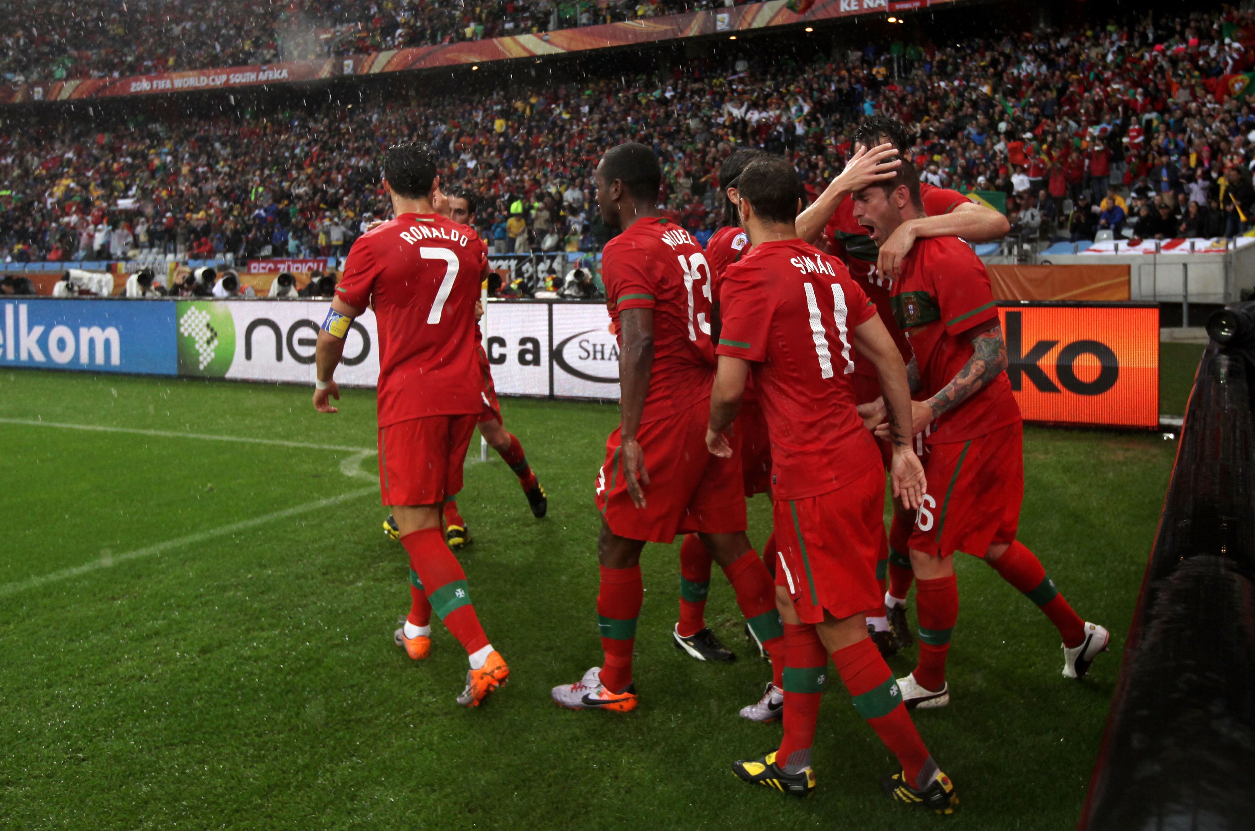 CAPE TOWN, SOUTH AFRICA - JUNE 21:  Raul Meireles of Portugal (R) celebrates scoring the opening goal with team mates during the 2010 FIFA World Cup South Africa Group G match between Portugal and North Korea at the Green Point Stadium on June 21, 2010 in