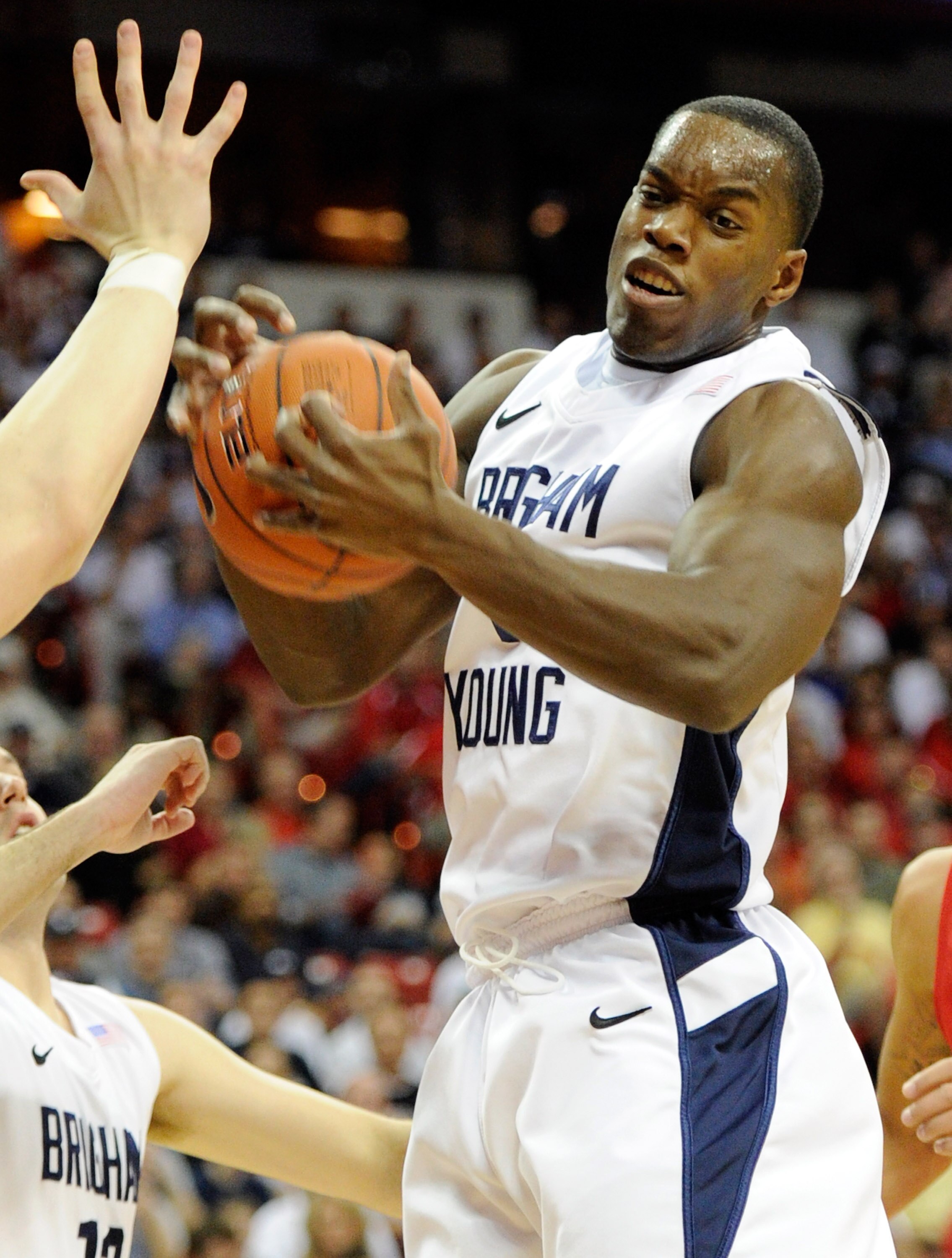 LAS VEGAS, NV - MARCH 11:  Charles Abouo #1 of the Brigham Young University Cougars grabs a rebound against the New Mexico Lobos during a semifinal game of the Conoco Mountain West Conference Basketball tournament at the Thomas & Mack Center March 11, 201