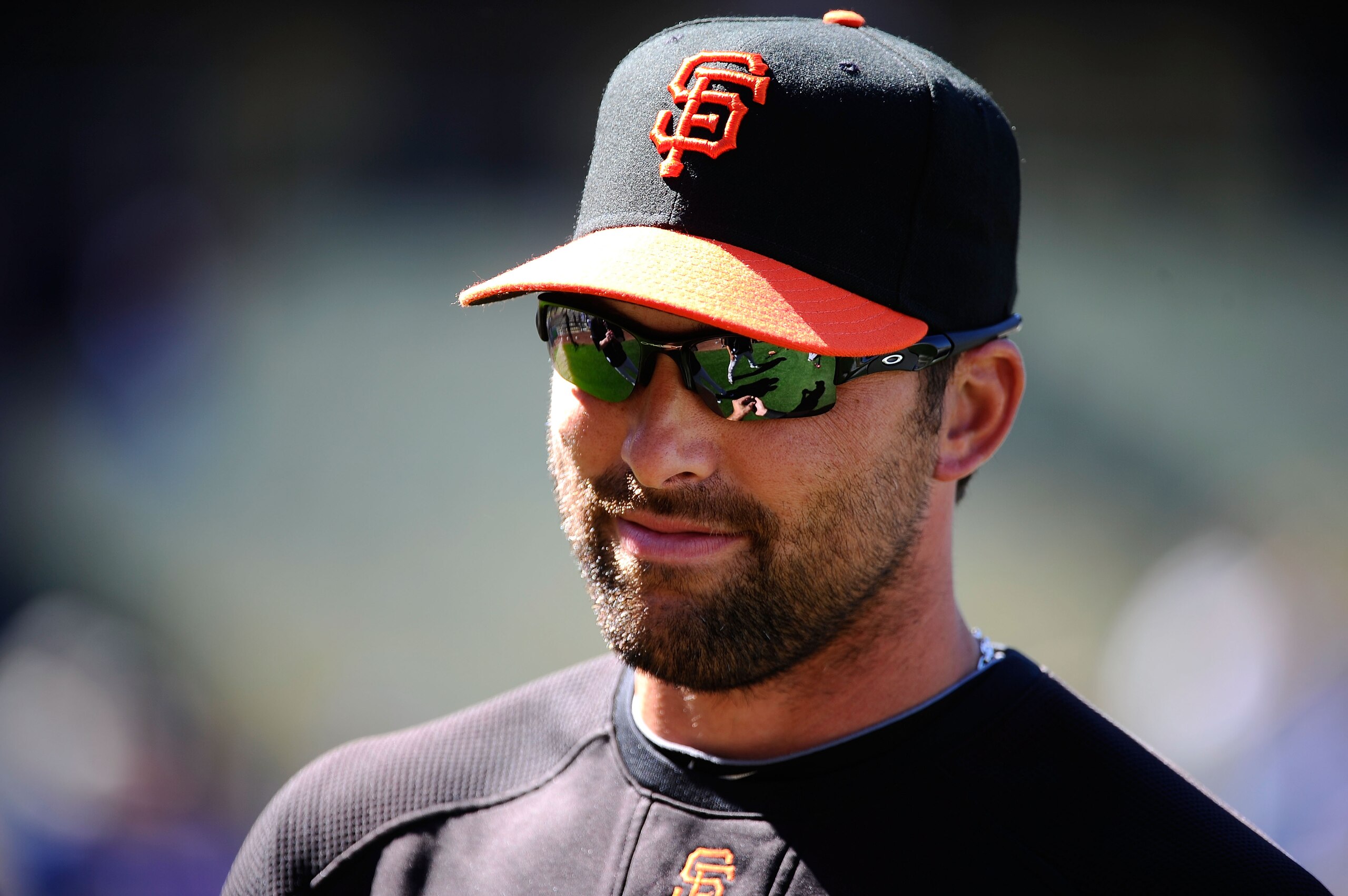 LOS ANGELES, CA - MARCH 31:  Mark DeRosa #7 of the San Francisco Giants looks on during warm ups prior to playing the Los Angeles Dodgers on Opening Day at Dodger Stadium on March 31, 2011 in Los Angeles, California.  (Photo by Kevork Djansezian/Getty Ima