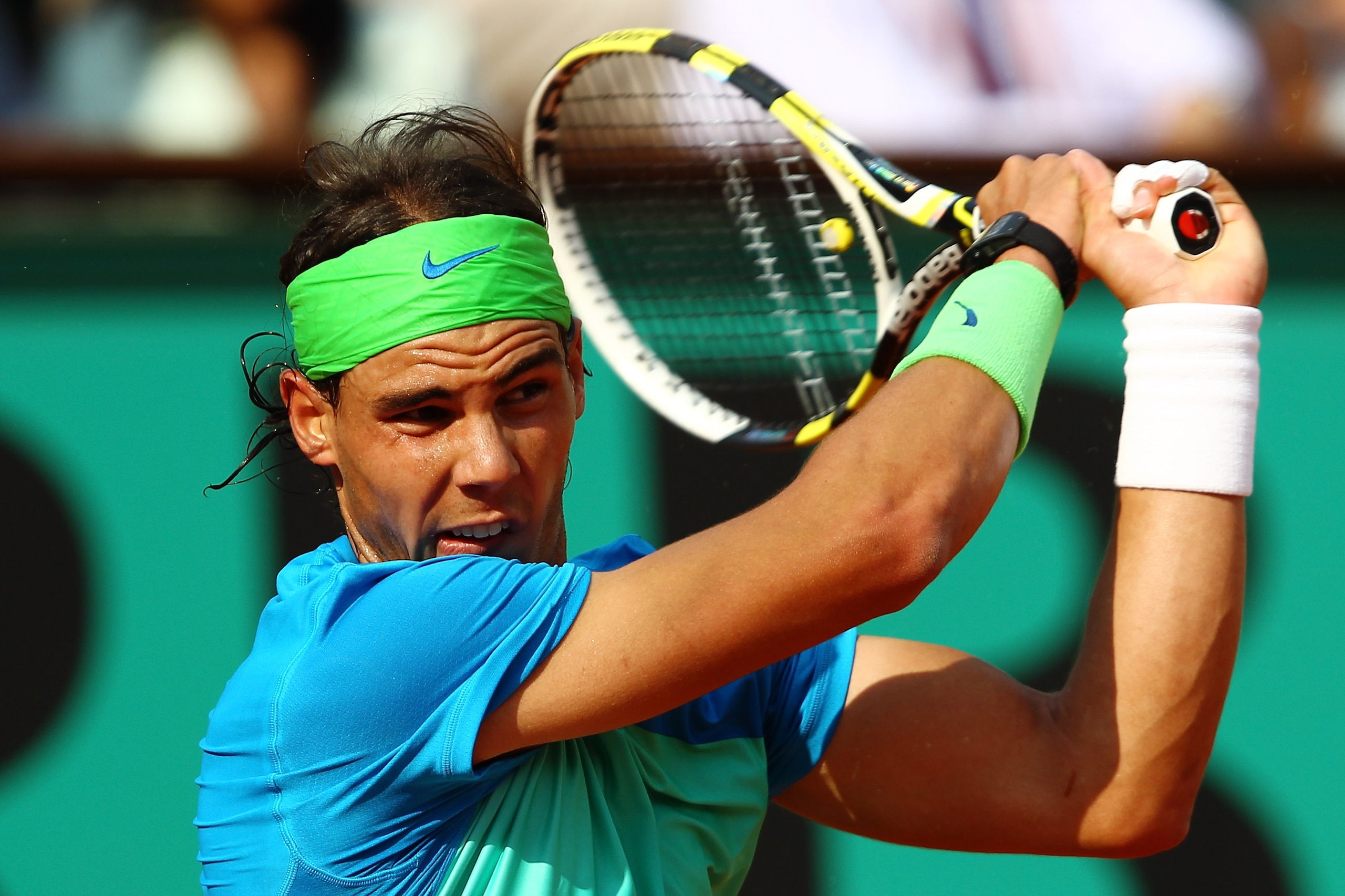 PARIS - JUNE 02:  Rafael Nadal of Spain plays a backhand during the men's singles quarter final match between Rafael Nadal of Spain and Nicolas Almagro of Spain at the French Open on day eleven of the French Open at Roland Garros on June 2, 2010 in Paris,