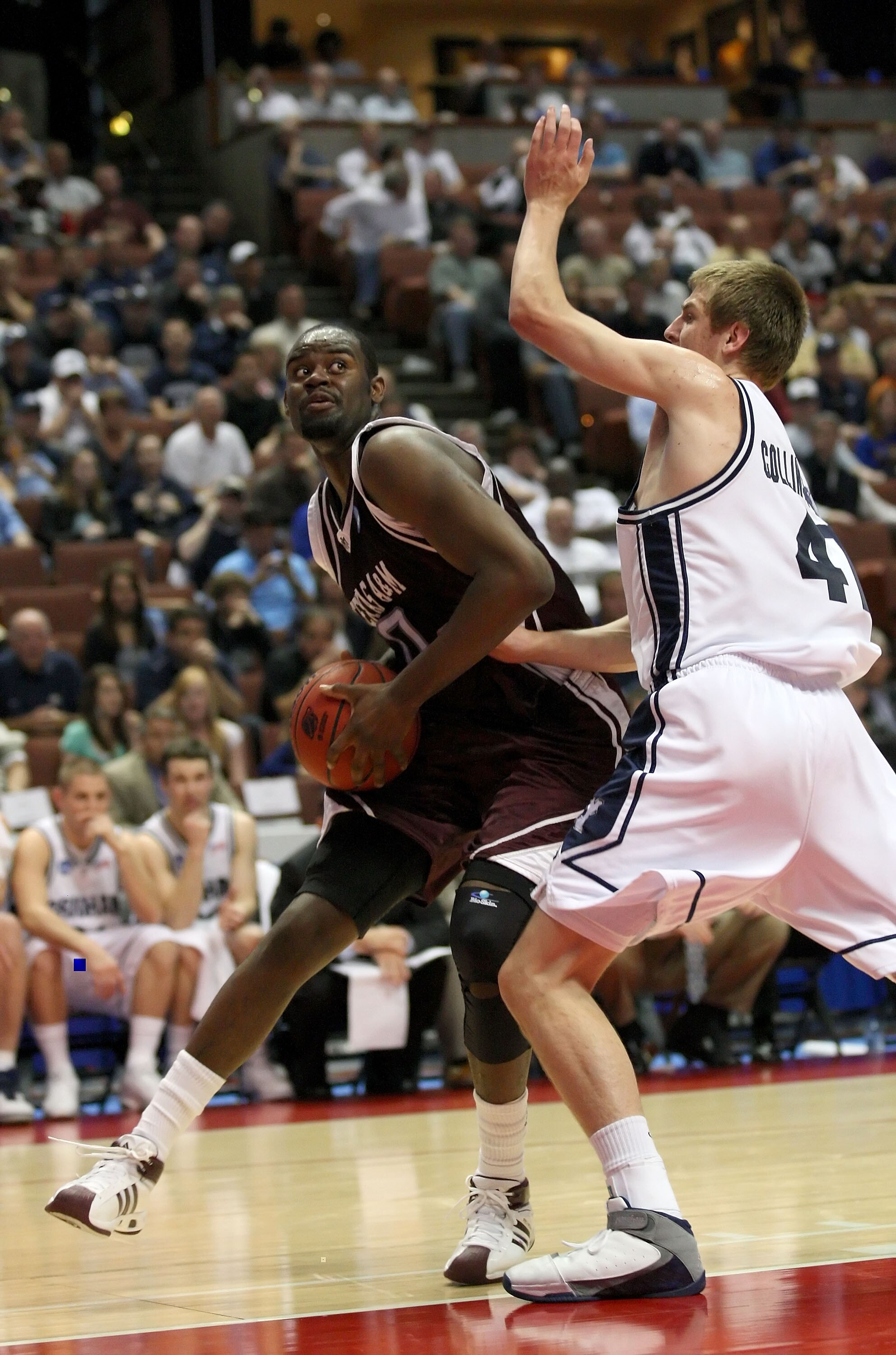 ANAHEIM, CA - MARCH 20:  Bryan Davis #0 of the Texas A&M Aggies moves against the defense of Chris Collinsworth #41 of the Brigham Young Cougars during the West Region first round of the NCAA Basketball Tournament at the Honda Center on March 20, 2008 in