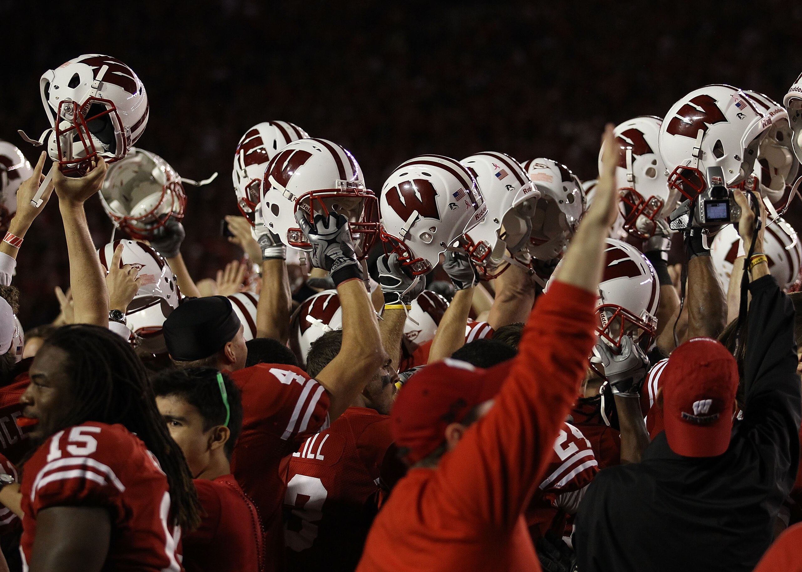 MADISON, WI - OCTOBER 16: Fans and players of the Wisconsin Badgers celebrate a win over the Ohio State Buckeyes at Camp Randall Stadium on October 16, 2010 in Madison, Wisconsin. Wisconsin defeated Ohio State 31-18. (Photo by Jonathan Daniel/Getty Images