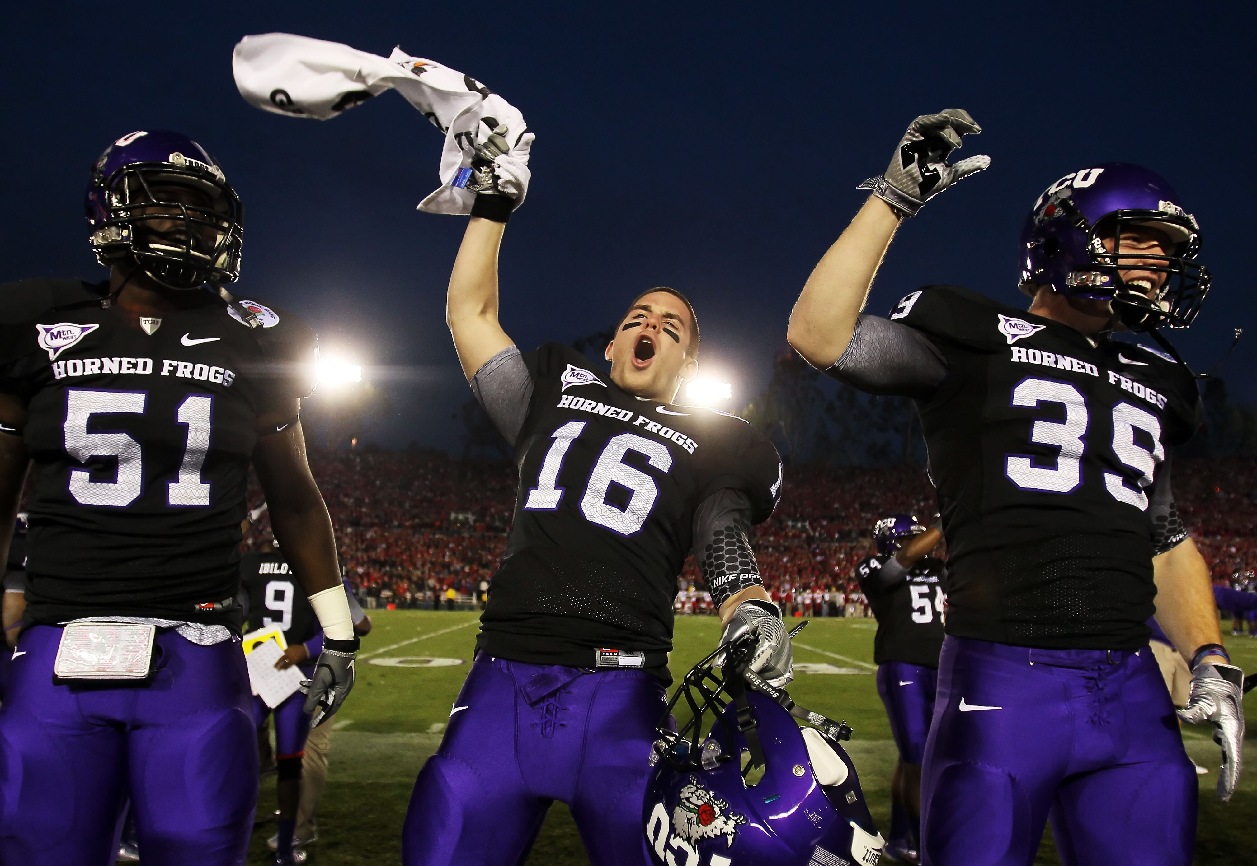 PASADENA, CA - JANUARY 01:  Safety Jurell Thompson #16 of the TCU Horned Frogs celebrates with teammates after defeating the Wisconsin Badgers 21-19 in the 97th Rose Bowl game on January 1, 2011 in Pasadena, California.  (Photo by Jeff Gross/Getty Images)