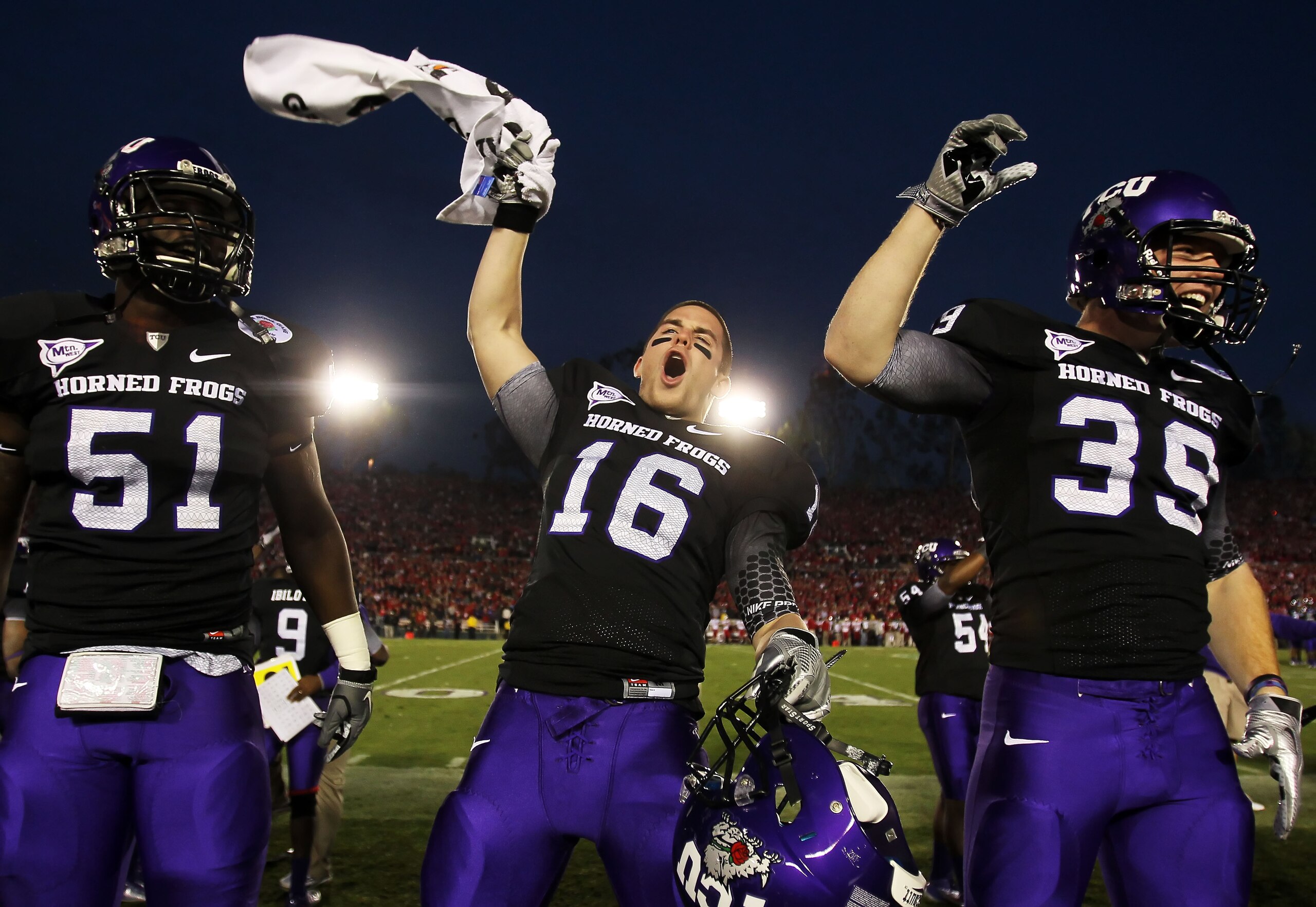 PASADENA, CA - JANUARY 01:  Safety Jurell Thompson #16 of the TCU Horned Frogs celebrates with teammates after defeating the Wisconsin Badgers 21-19 in the 97th Rose Bowl game on January 1, 2011 in Pasadena, California.  (Photo by Jeff Gross/Getty Images)